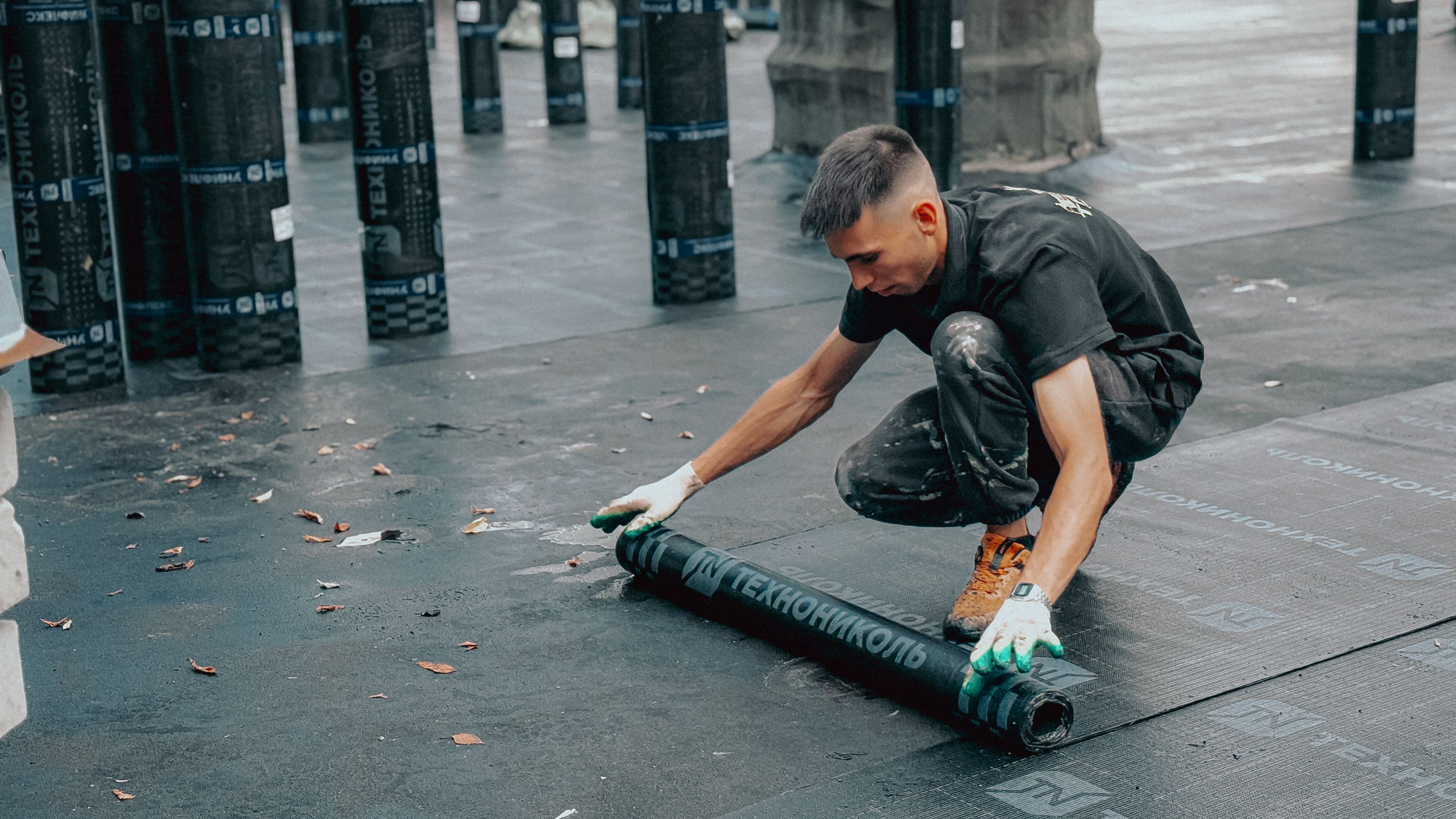 Contractor working on a commercial roof installation