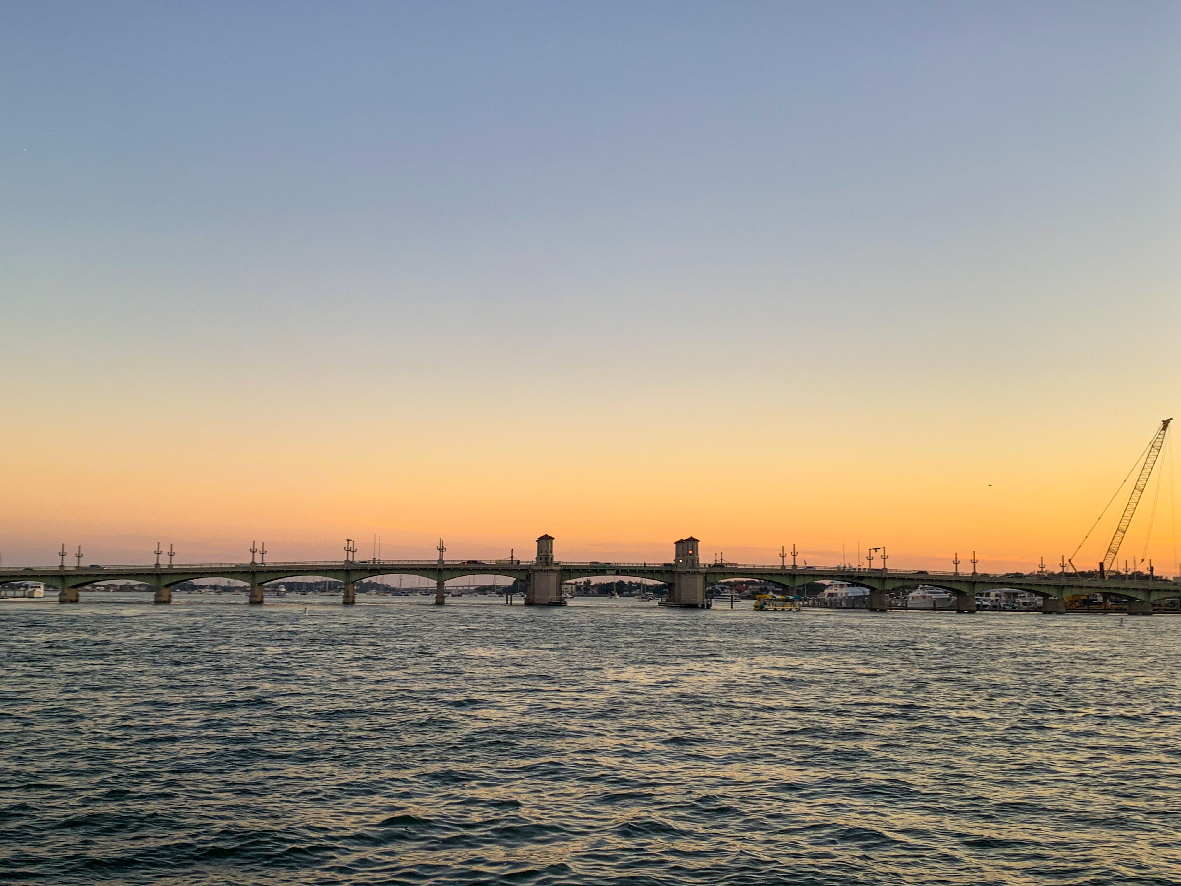 Wide sunset panoramic view over St. Augustine harbor and Bridge of Lions