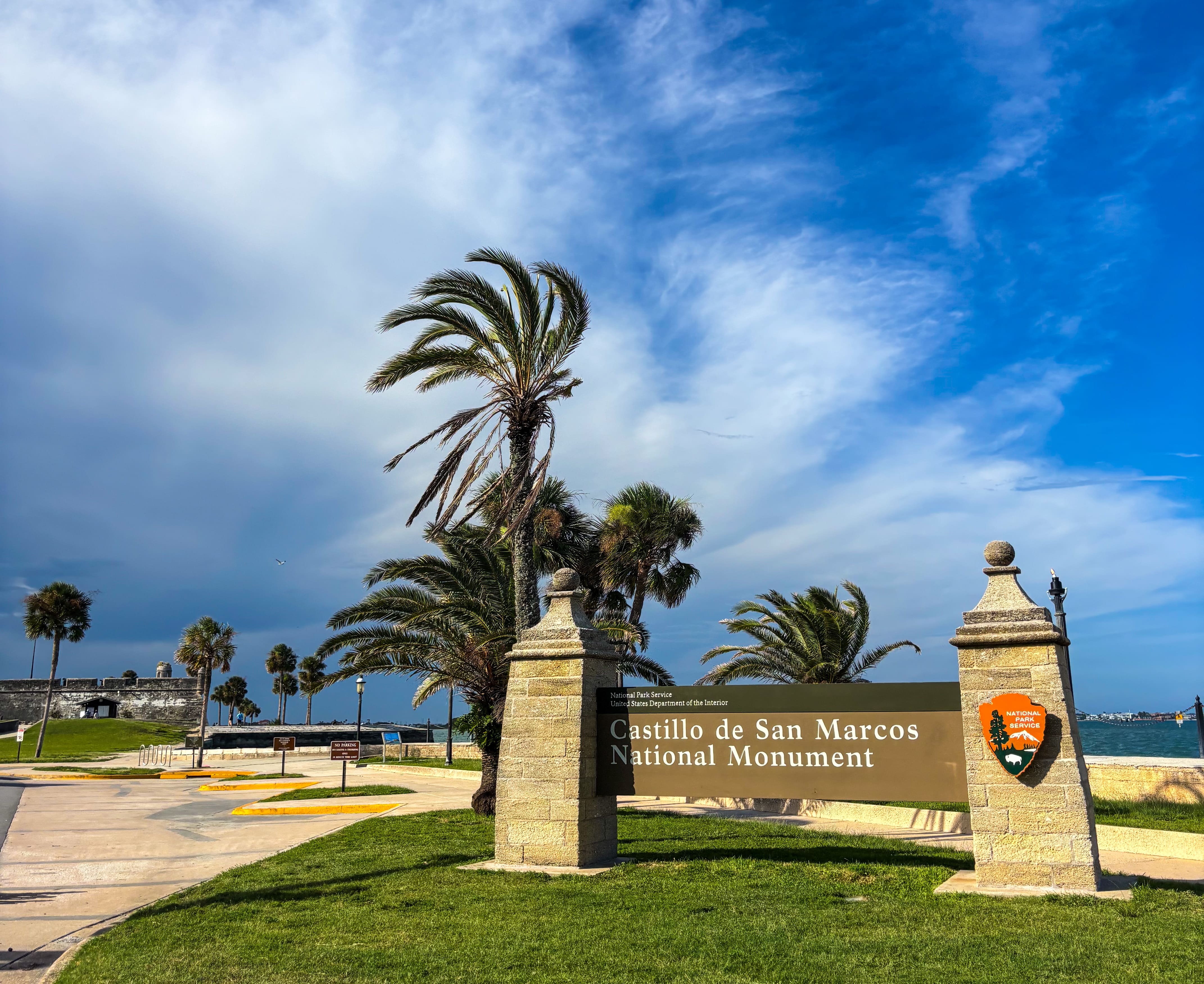 Castillo de San Marcos National Monument coquina stone entrance sign and palm trees