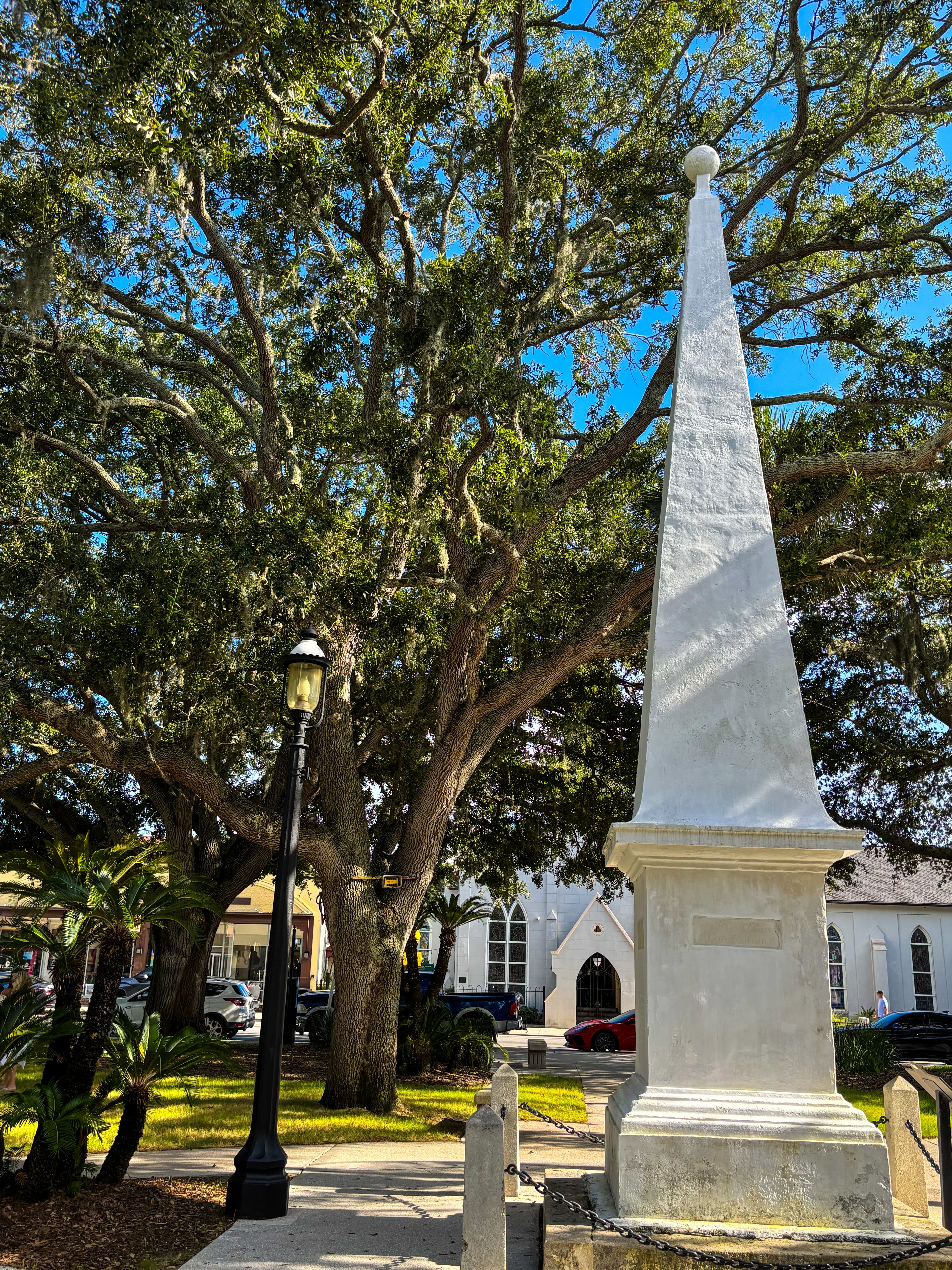 Plaza de la Constitución historic obelisk monument surrounded by Spanish moss live oaks