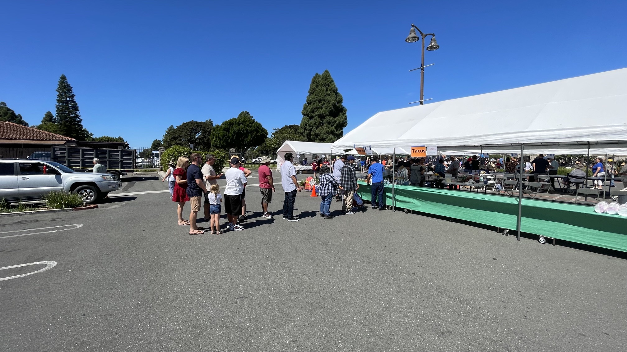 Parishioners and festival attendees in line for food and refreshments under the festival tent at St. Vincent de Paul