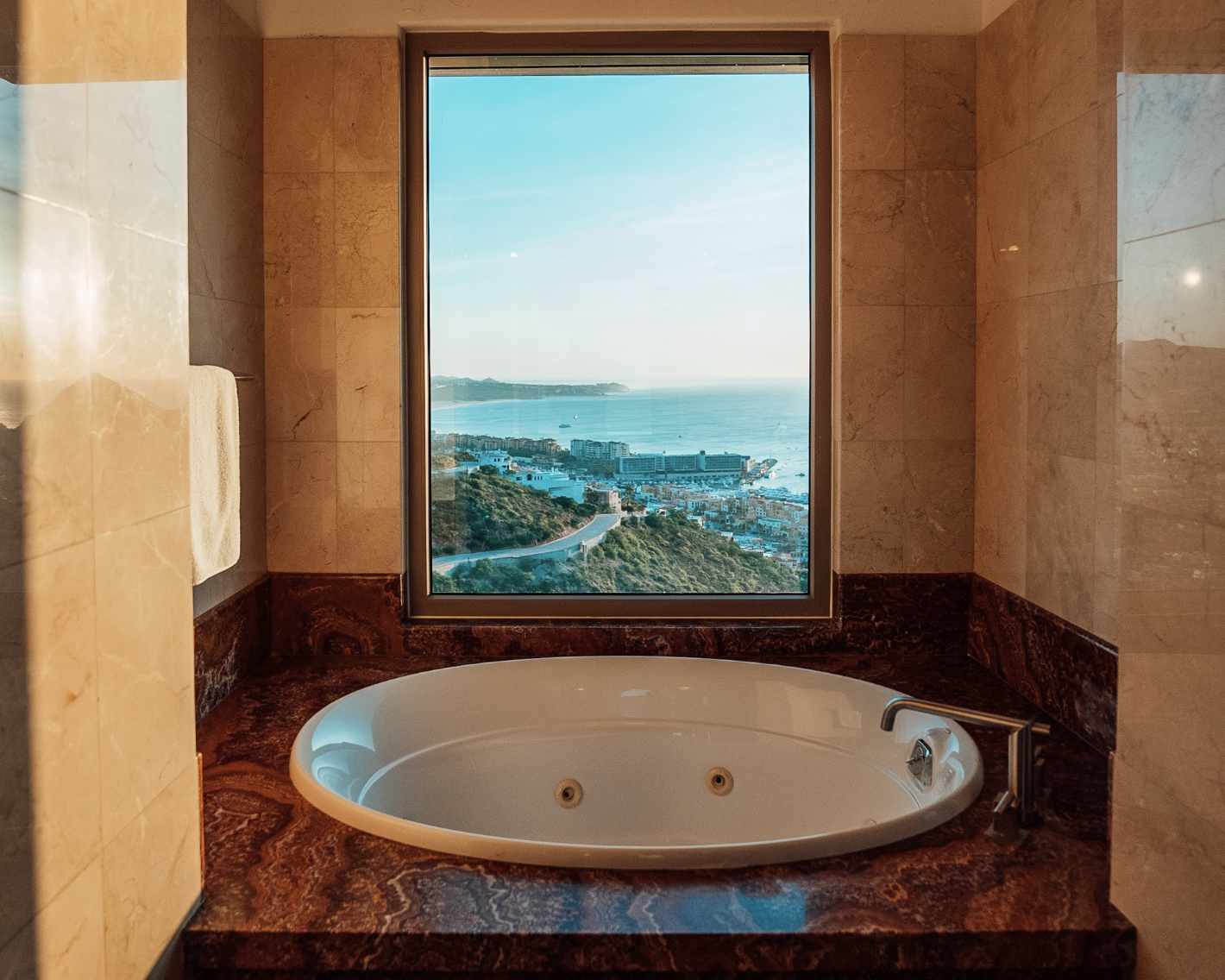 Luxury Ocean-View Jacuzzi Tub Framed by Marble & Coastal Horizons