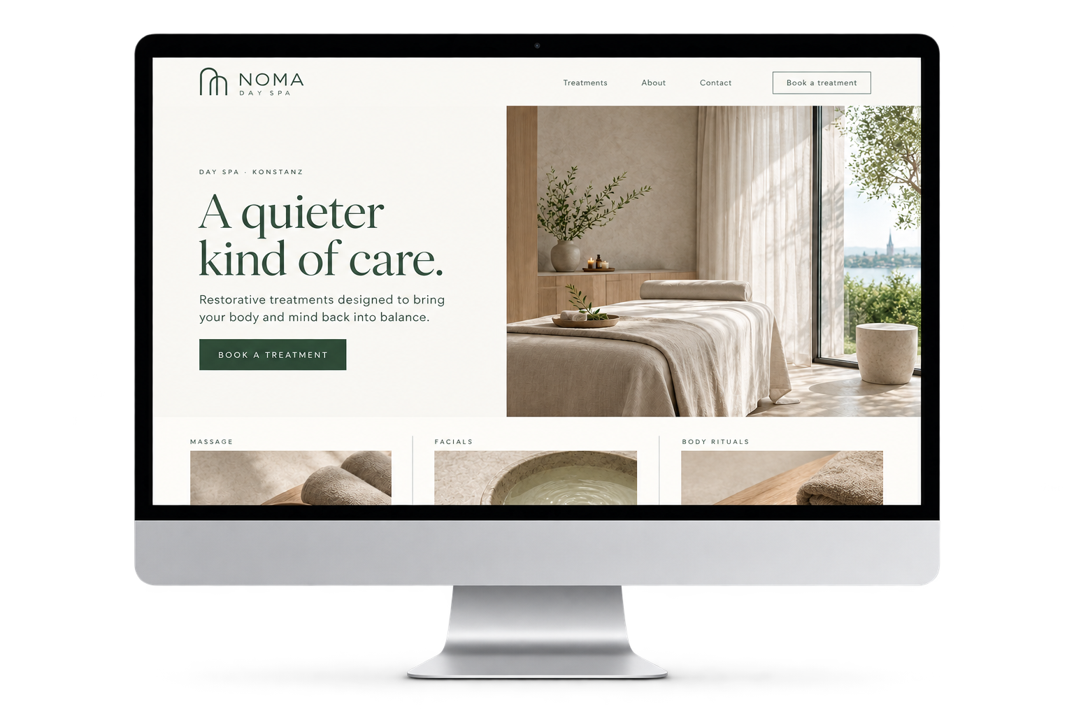 NOMA Day Spa website displayed on an iMac