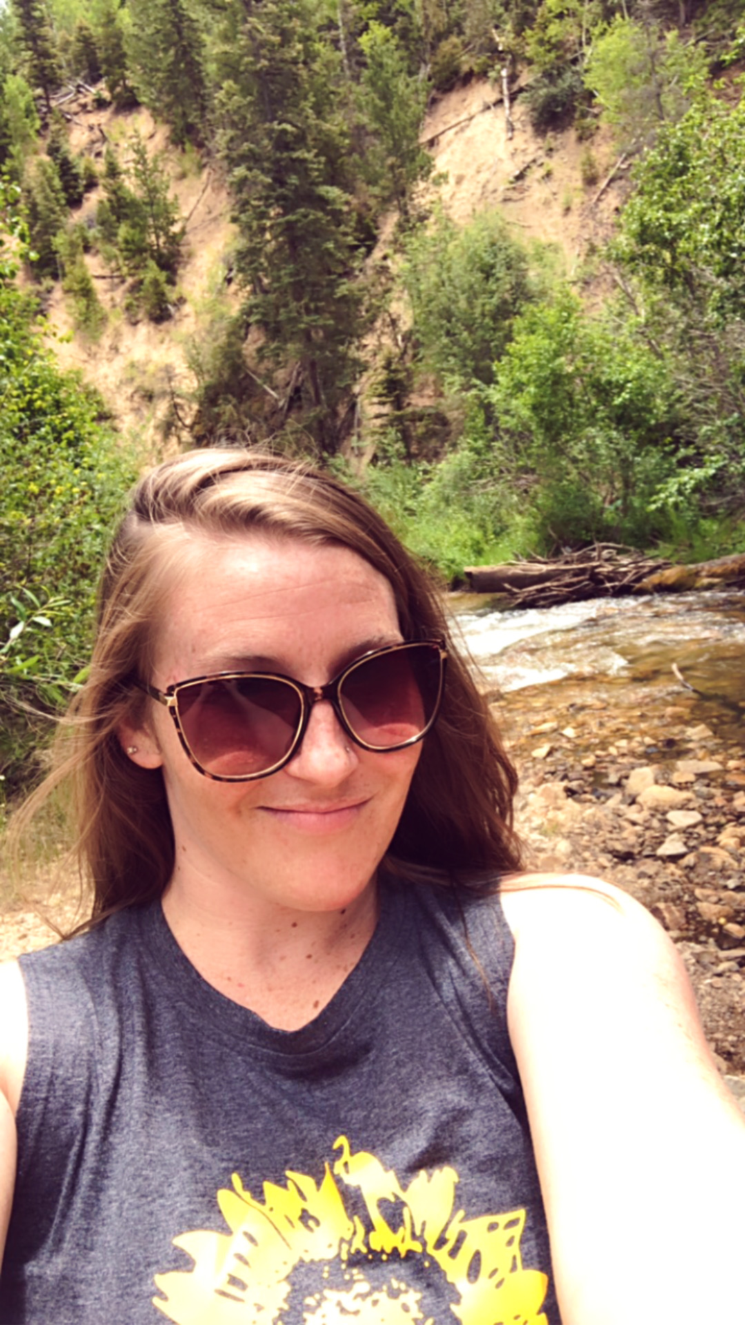 Kally Macias smiling outdoors, your guide to attraction marketing