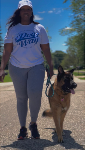 Founder and dog behavior trainer walking with dog - Walworth County's Dog Trainers & Sitting