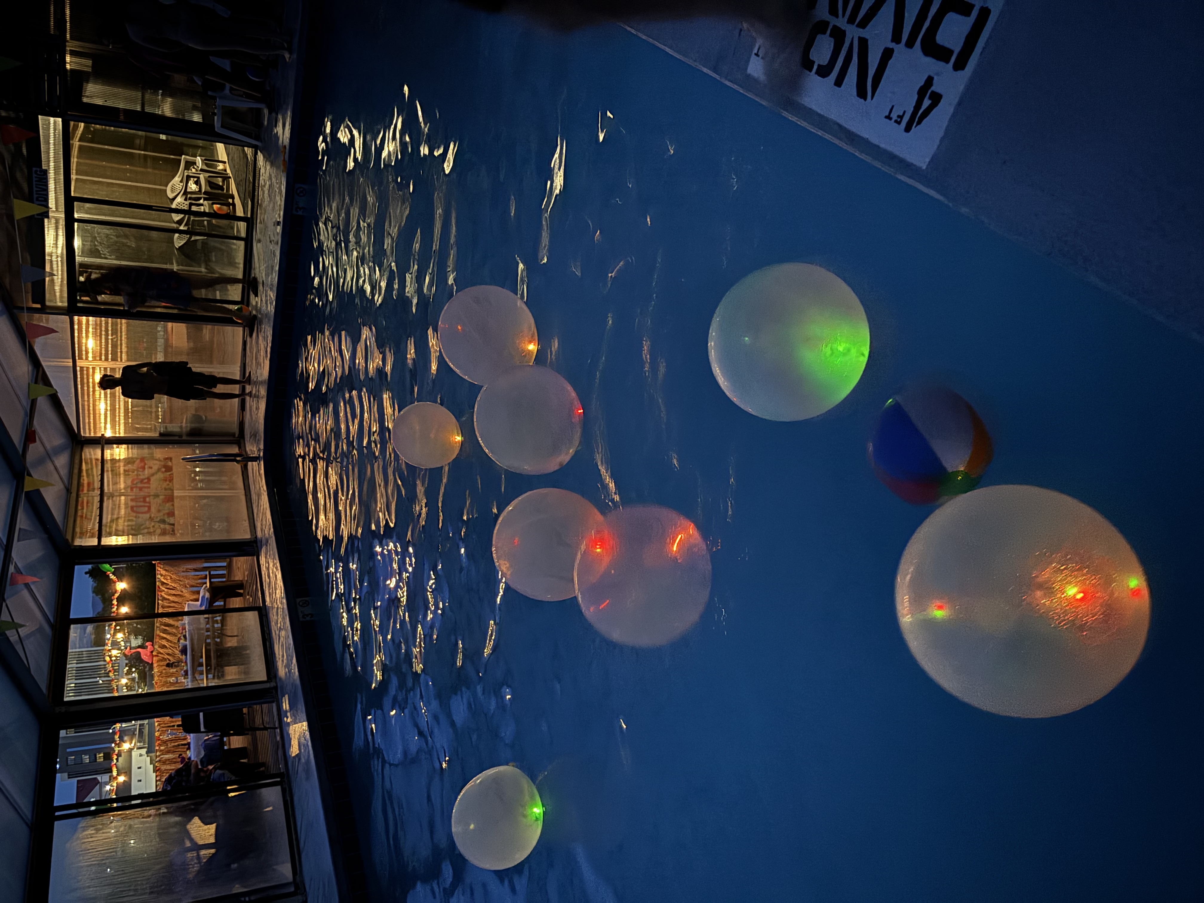 Glow balloons and nighttime pool party celebration at Olympia Athletic Club