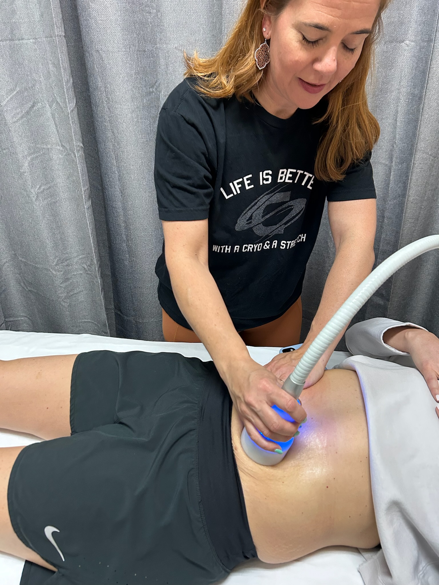 Hope Hall administering a Neveskin cold therapy session