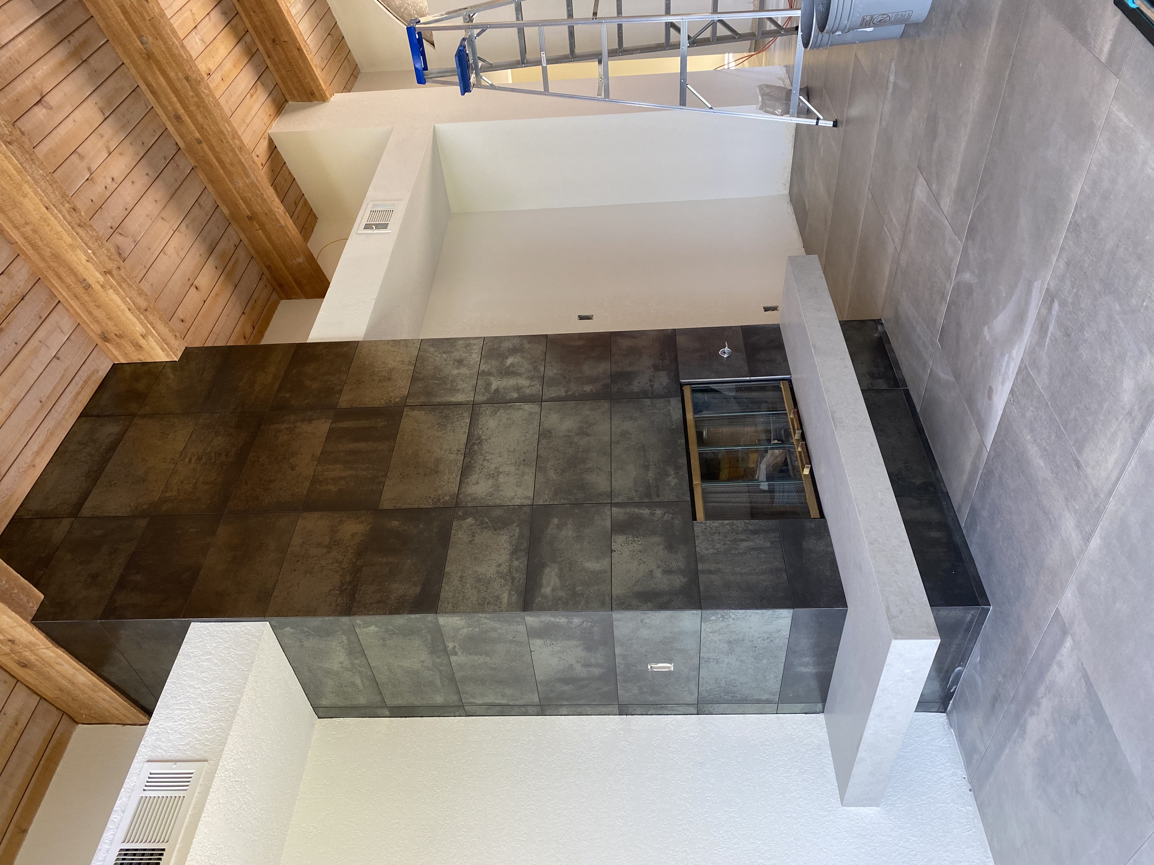 Oxidized Metallic Fireplace & Hearth completed by Davenport Tile