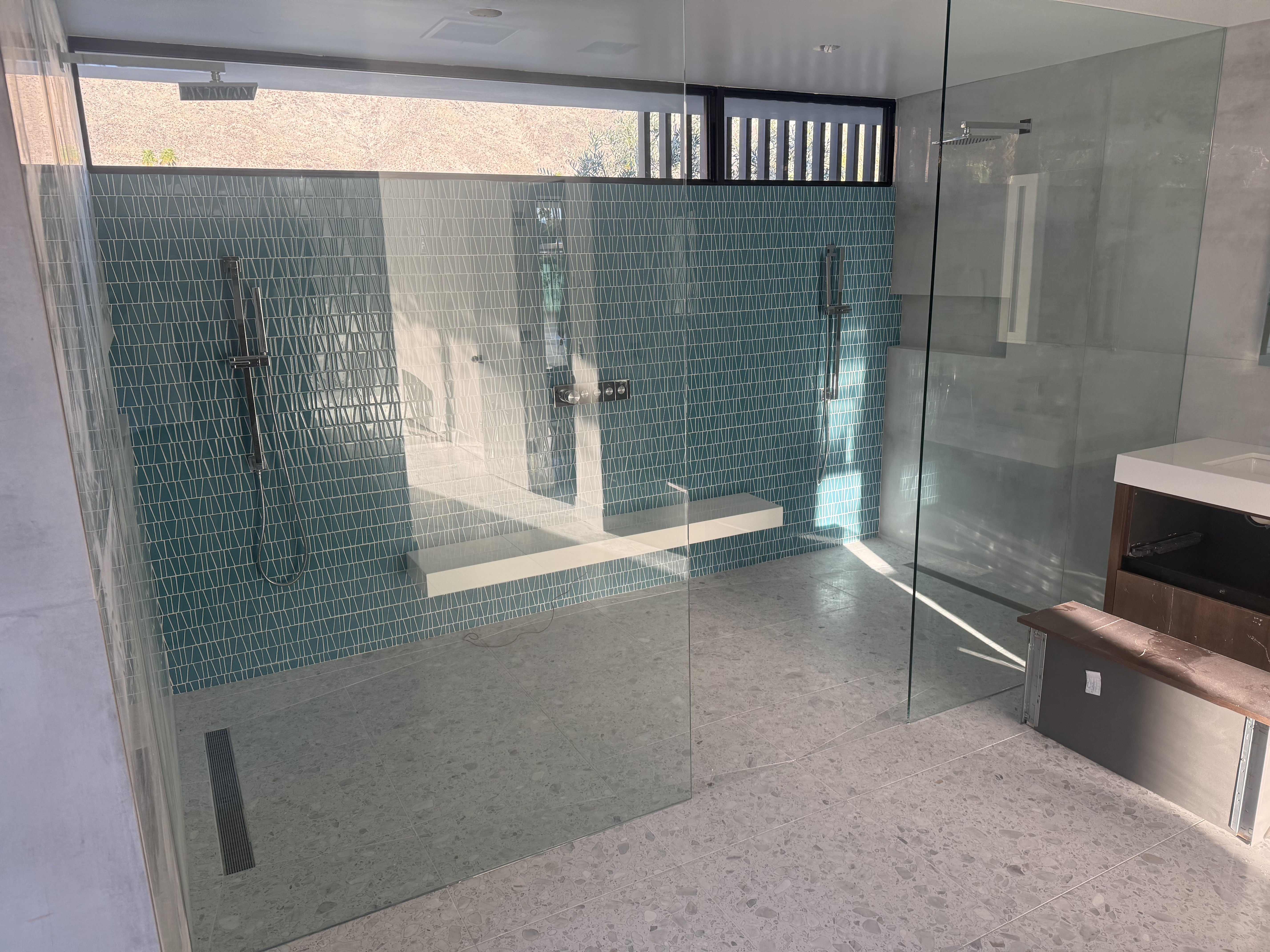 Indoor-Outdoor Curbless Shower Suite project by Davenport Tile