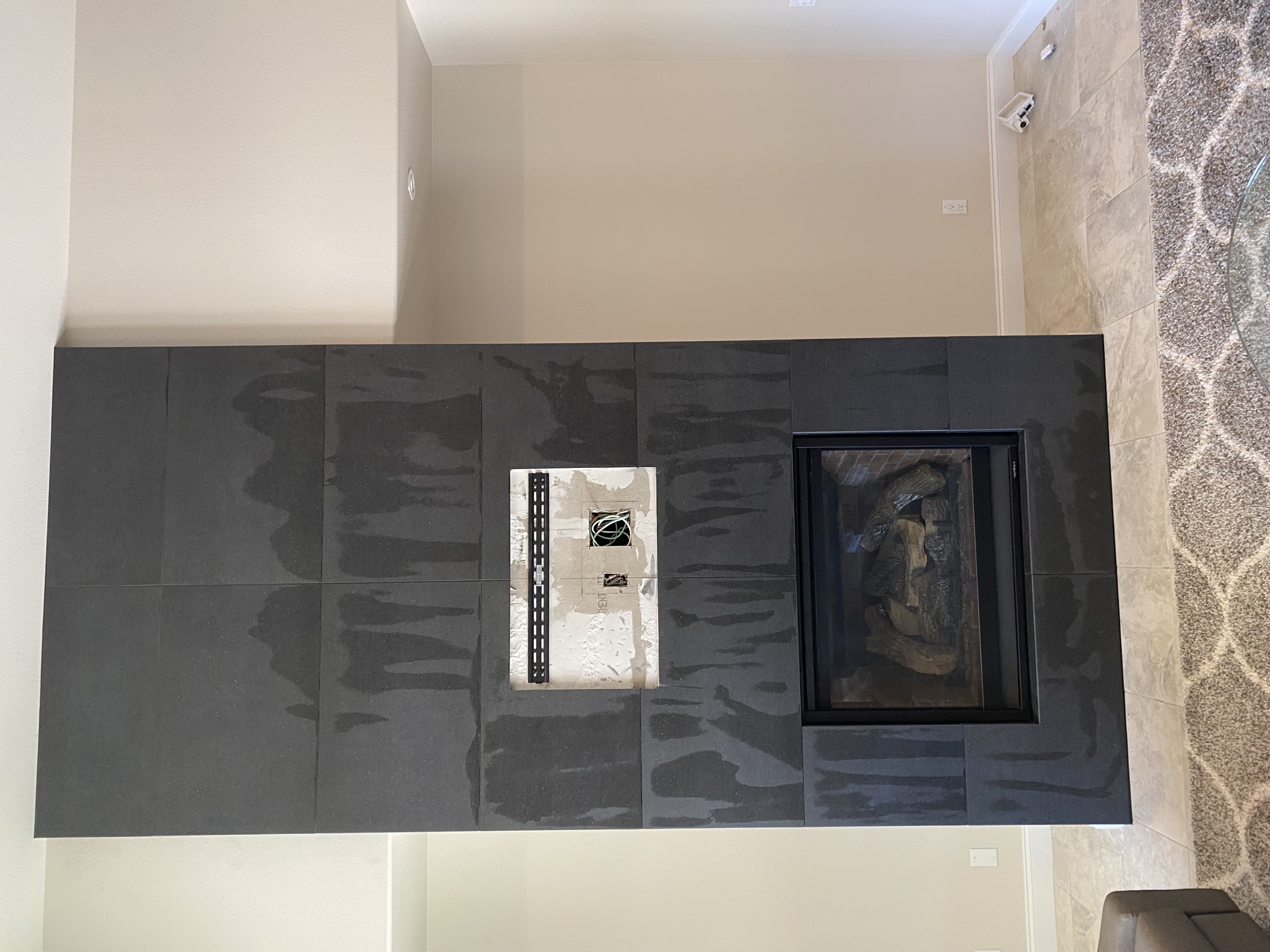 Large-Format Dark Porcelain Fireplace project by Davenport Tile