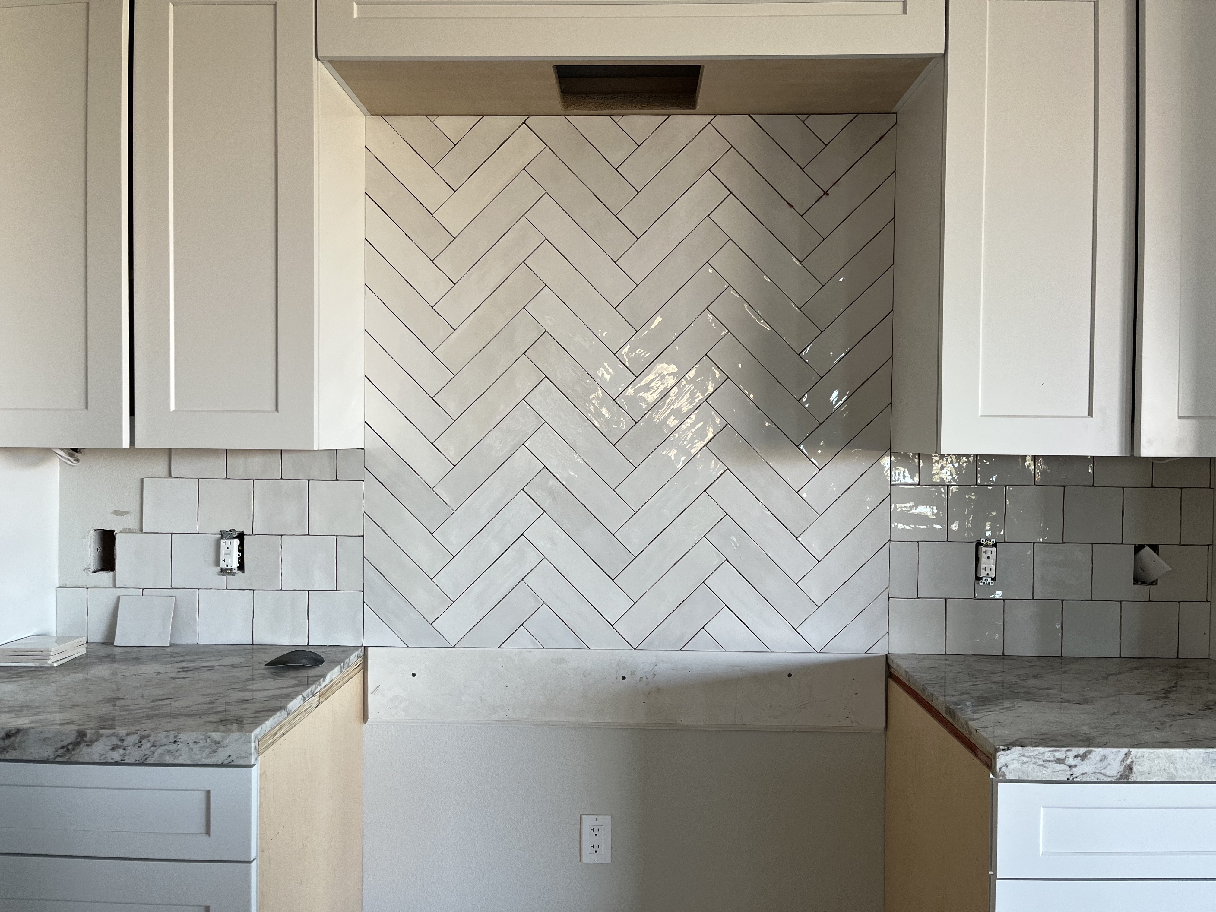 Herringbone Kitchen Backsplash completed by Davenport Tile