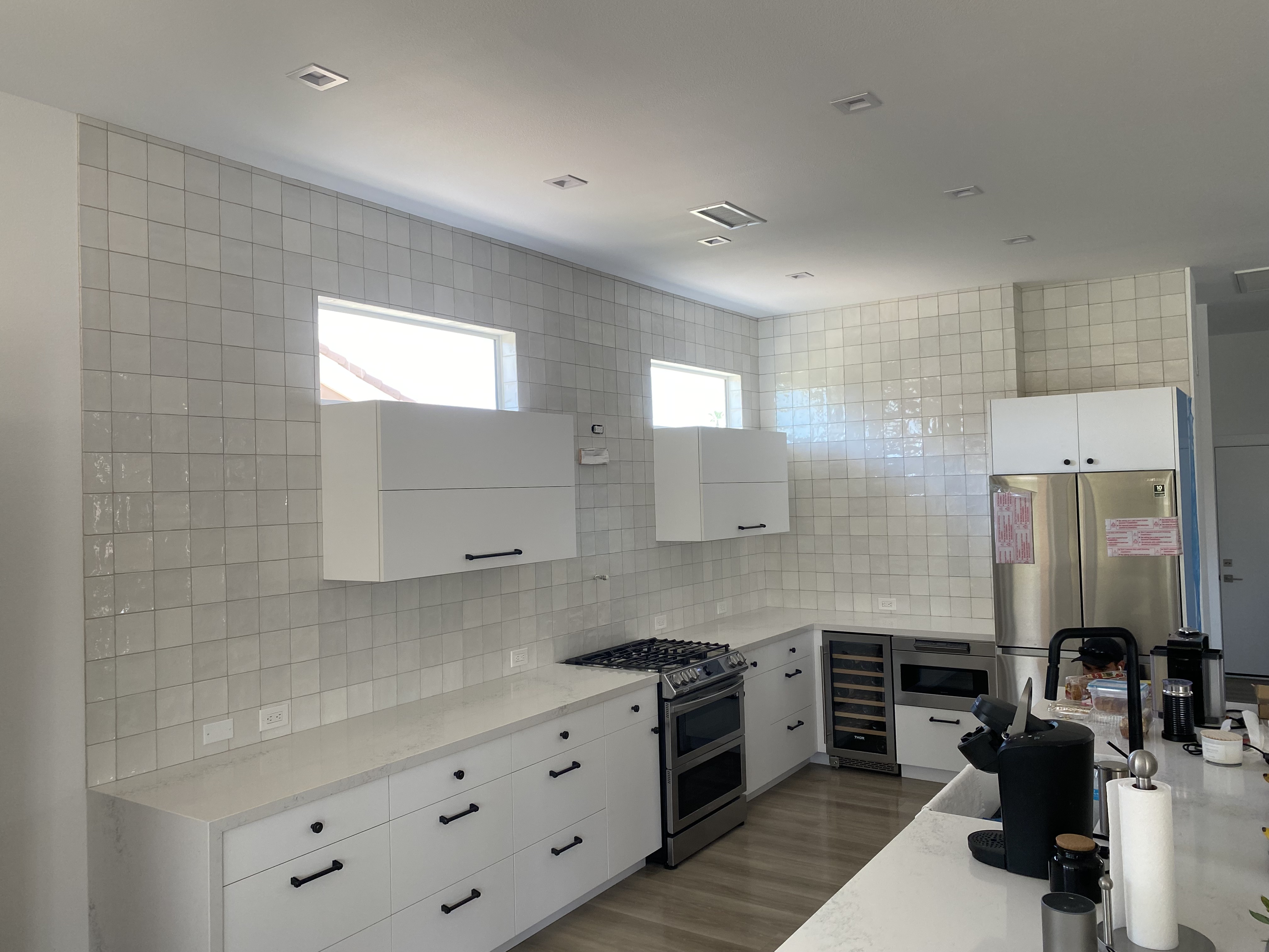 Full-Height White Grid Accent Wall project by Davenport Tile