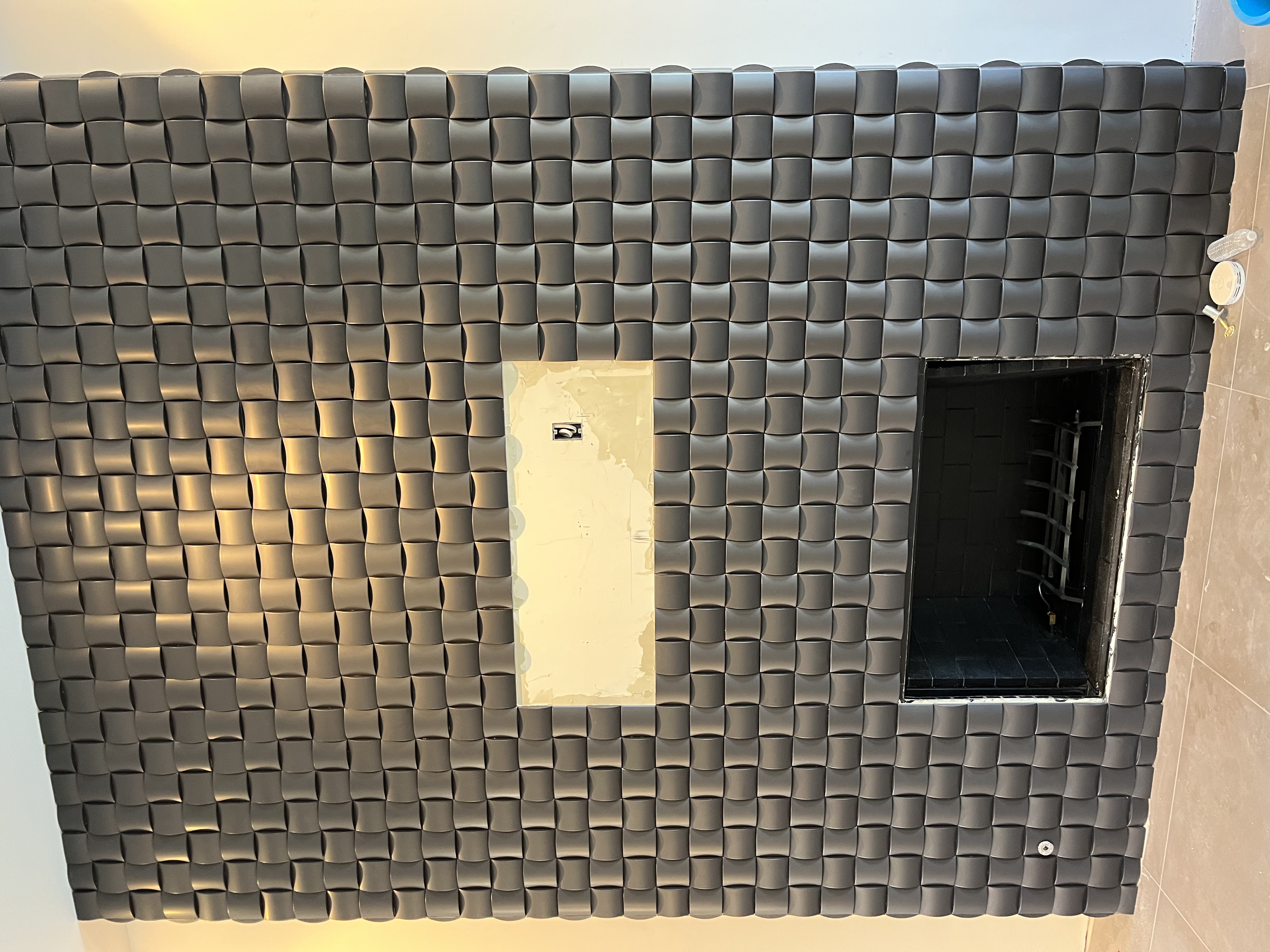 Sculptural 3D Pillow Fireplace Surround project by Davenport Tile
