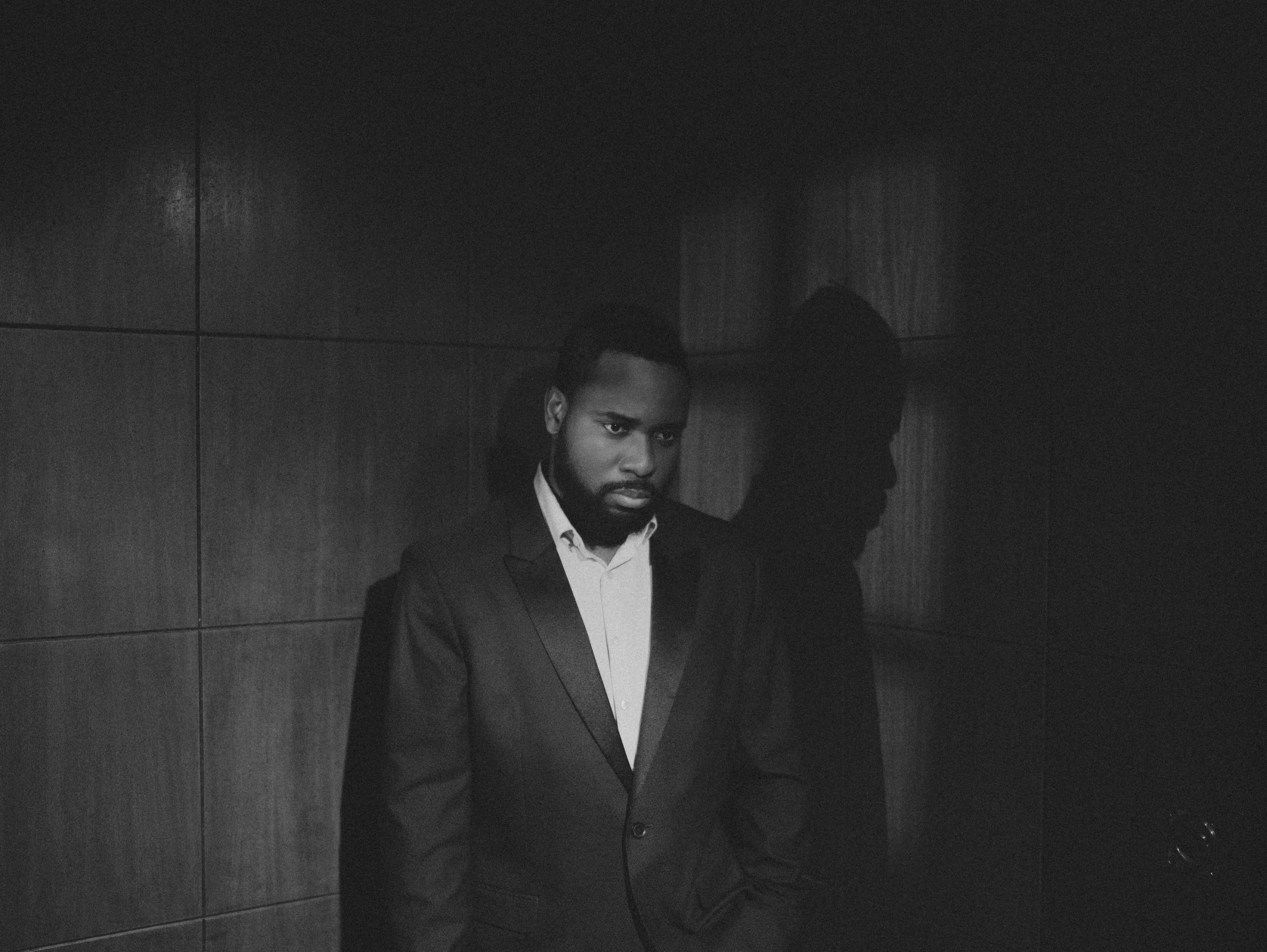 Abraham, husband and pastor, in a dark suit