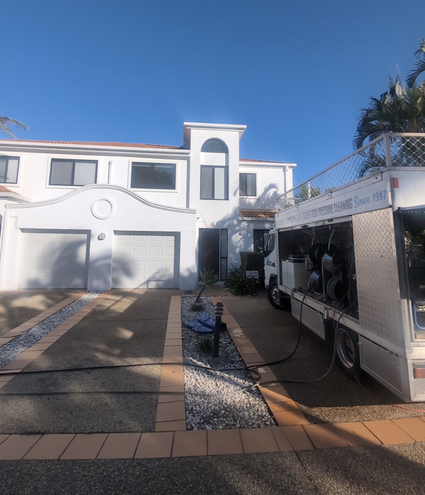 Wallys Master Blaster soft wash and high pressure cleaning truck on a residential job in the Gold Coast — operating since 1987