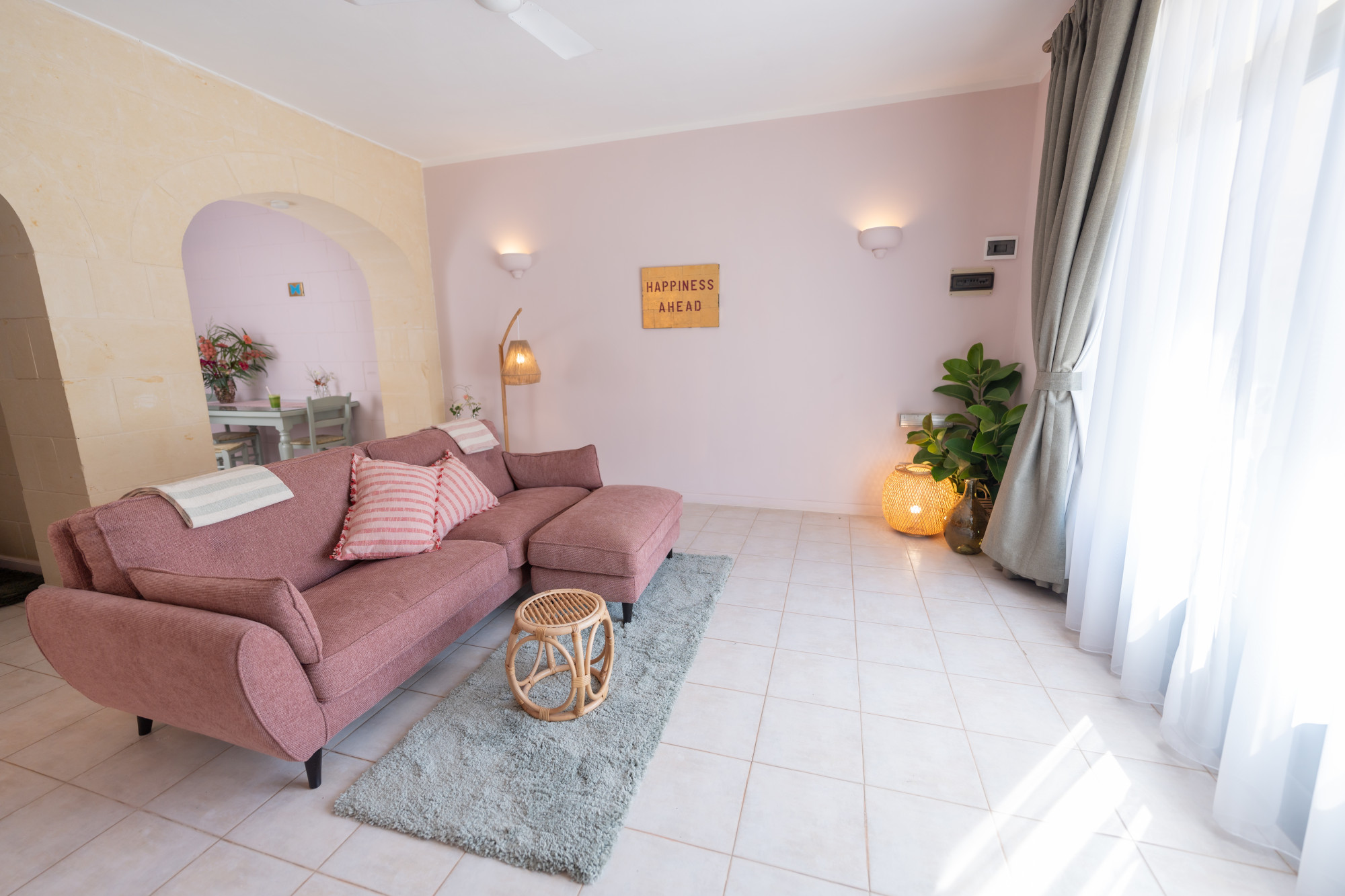Spacious deluxe apartment living room with Mediterranean stone archway