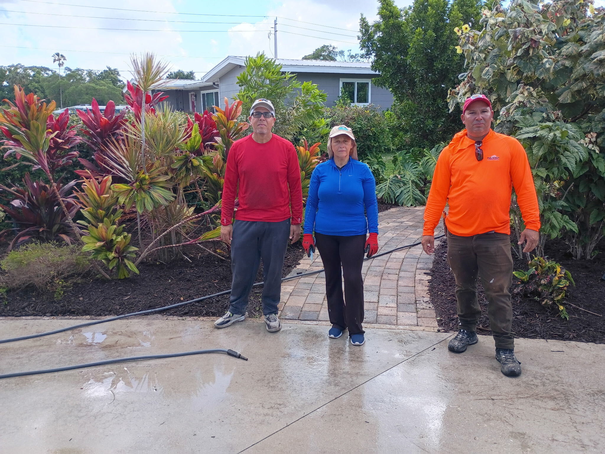 Bless Gardenz crew on site after pressure cleaning driveway and paver walkway in Southwest Florida
