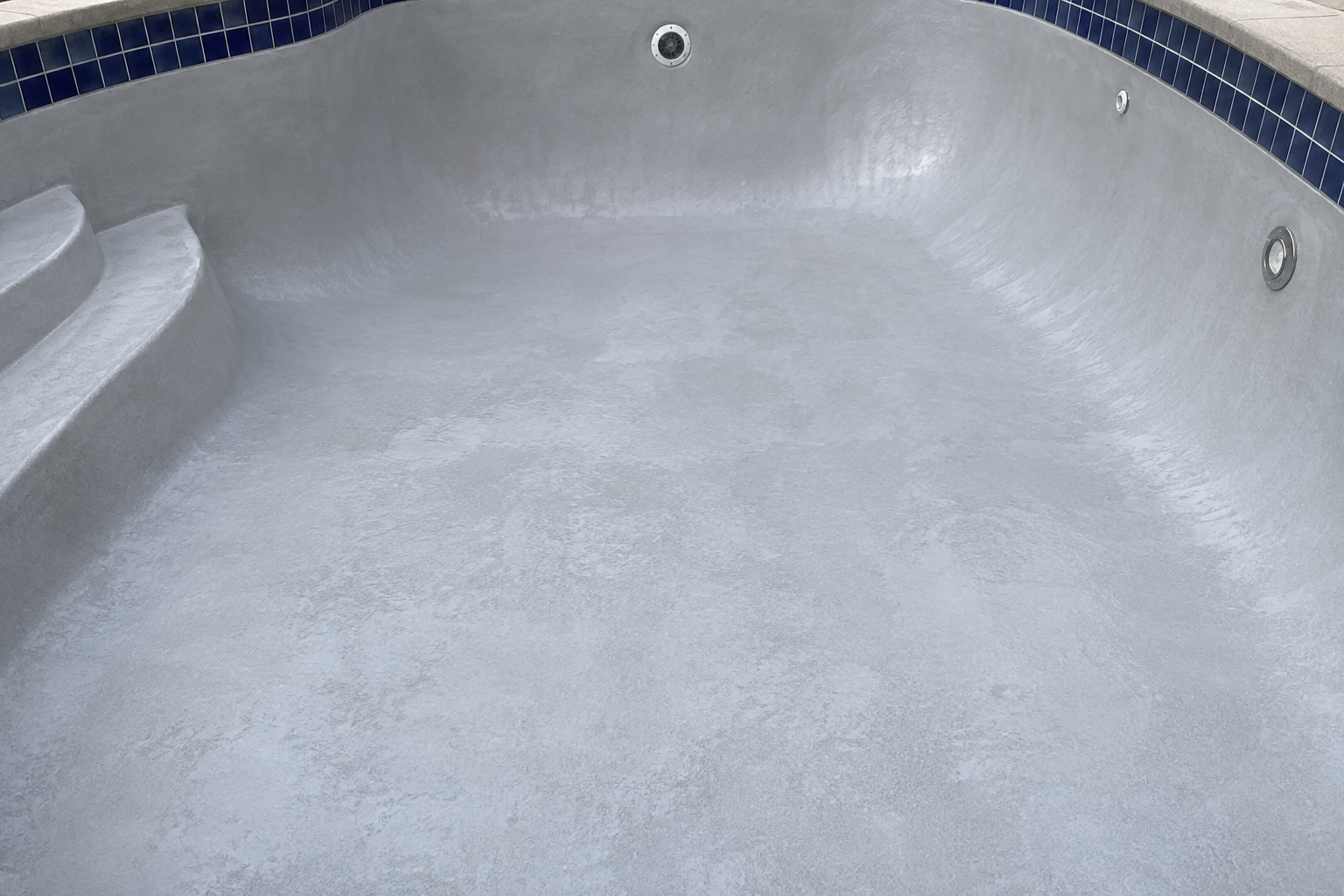Pool replastering in Cypress freshly plastered white and quartz pool shell with sealed coping and tile