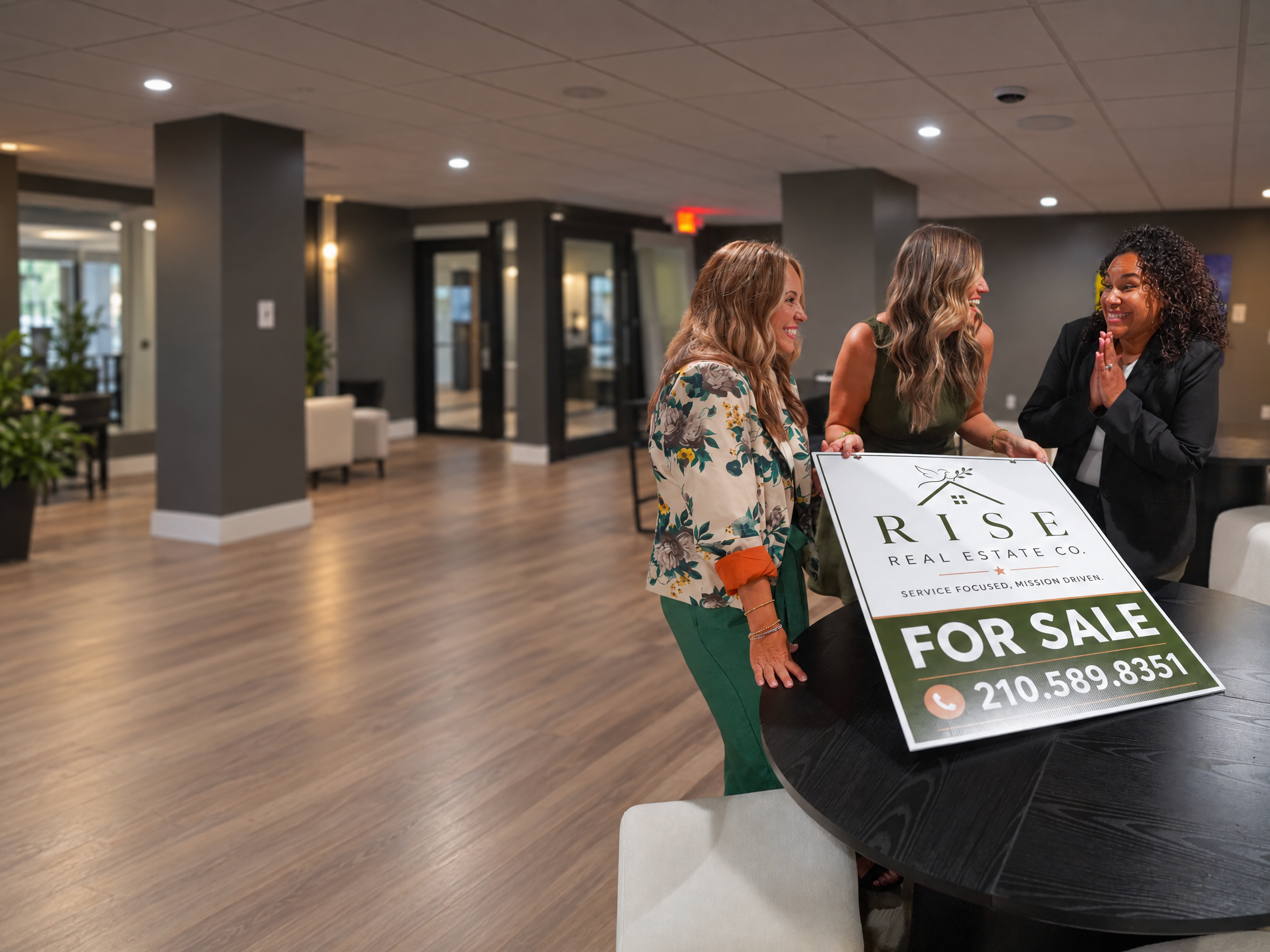 The RISE Real Estate Company team — Nicole French, Brynn Knapp, and Monique Summers with RISE For Sale sign