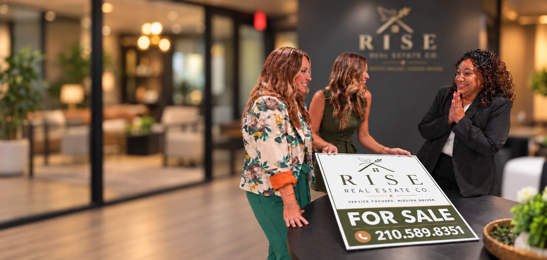 The RISE Real Estate Company team — Nicole French, Brynn Knapp, and Monique Summers with RISE For Sale sign
