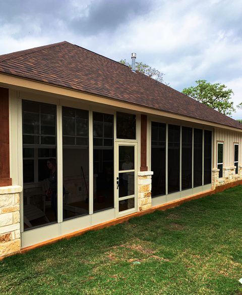 Custom enclosed patio and screen porch addition with stone accents