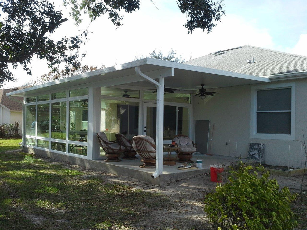Patio cover with integrated glass room enclosure in San Antonio