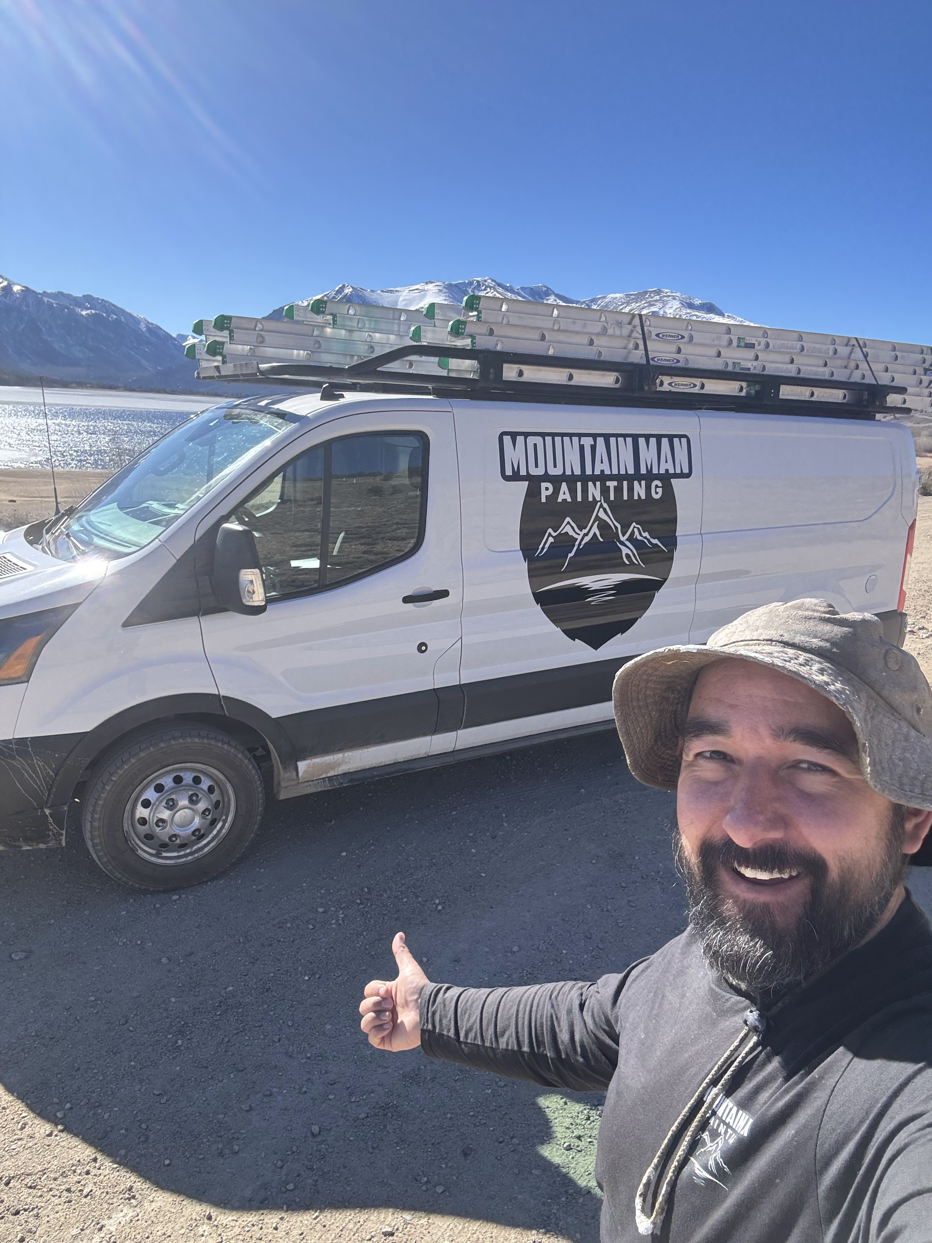 Derek Shandonay, owner of Mountain Man Painting, on site in Twin Lakes, CO with the company work van
