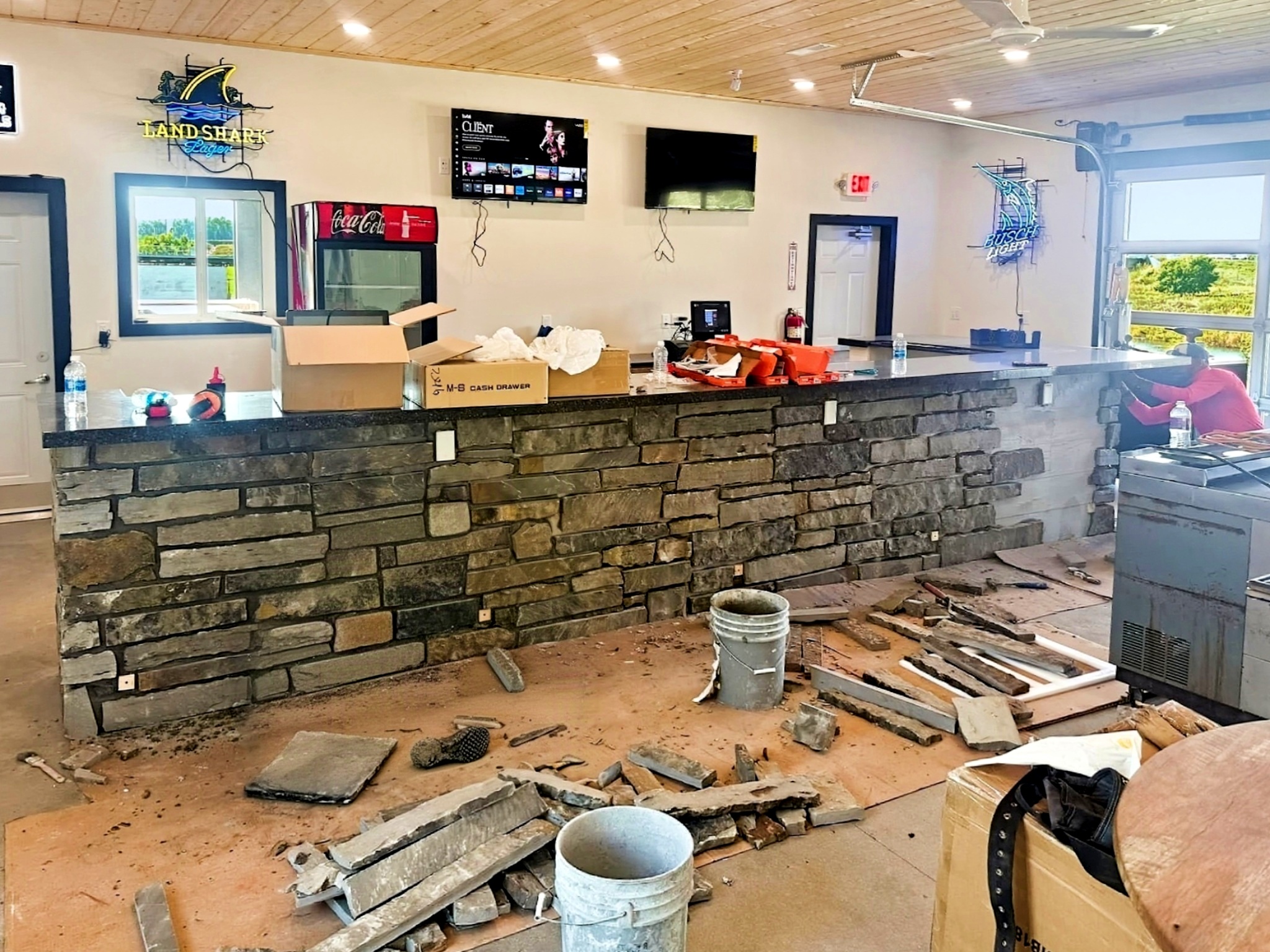 Finished commercial interior with stone bar built by Westland in Siouxland