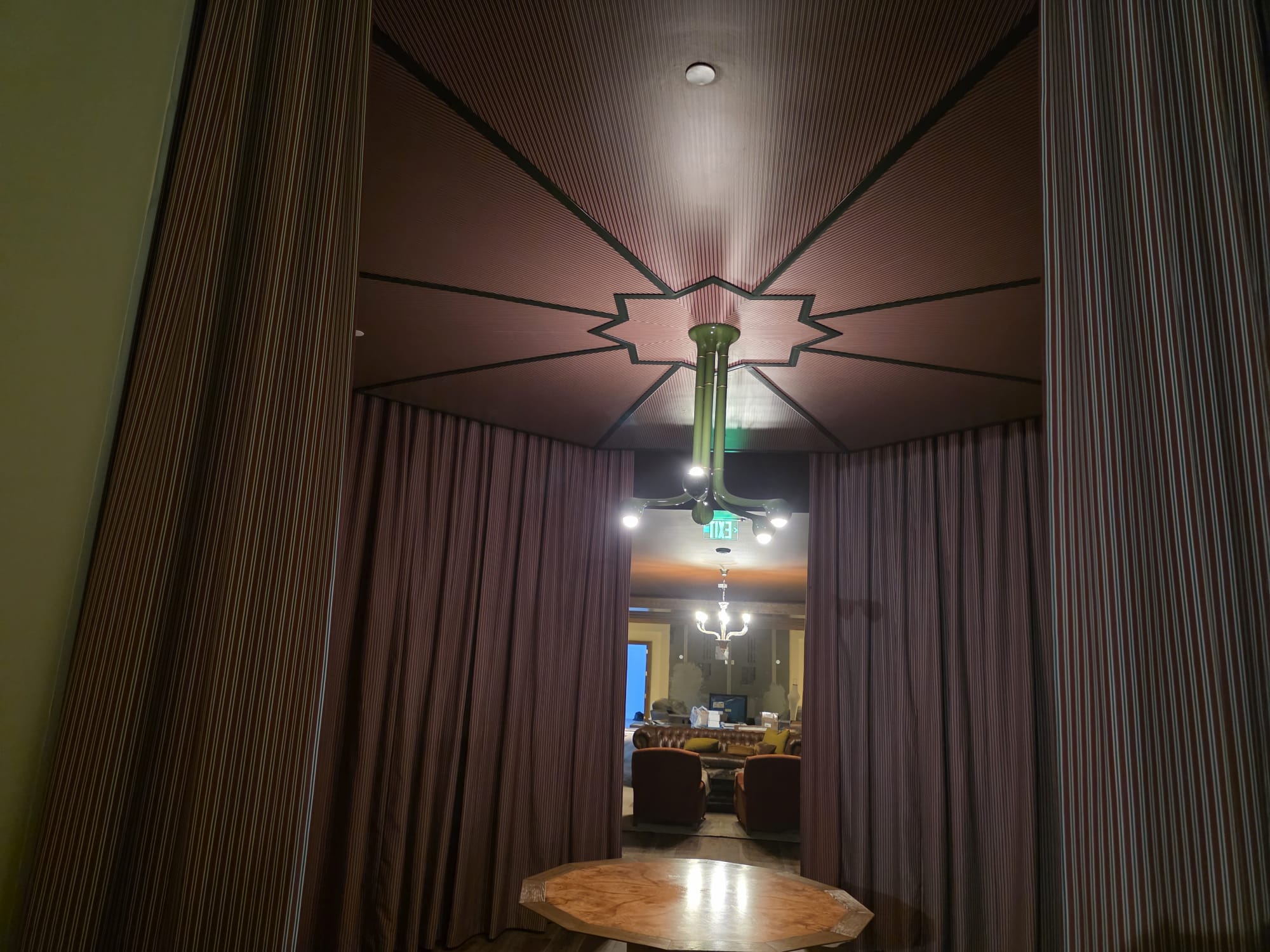 Geometric 8-point star architectural wood slat ceiling medallion and modern chandelier in Greensboro NC