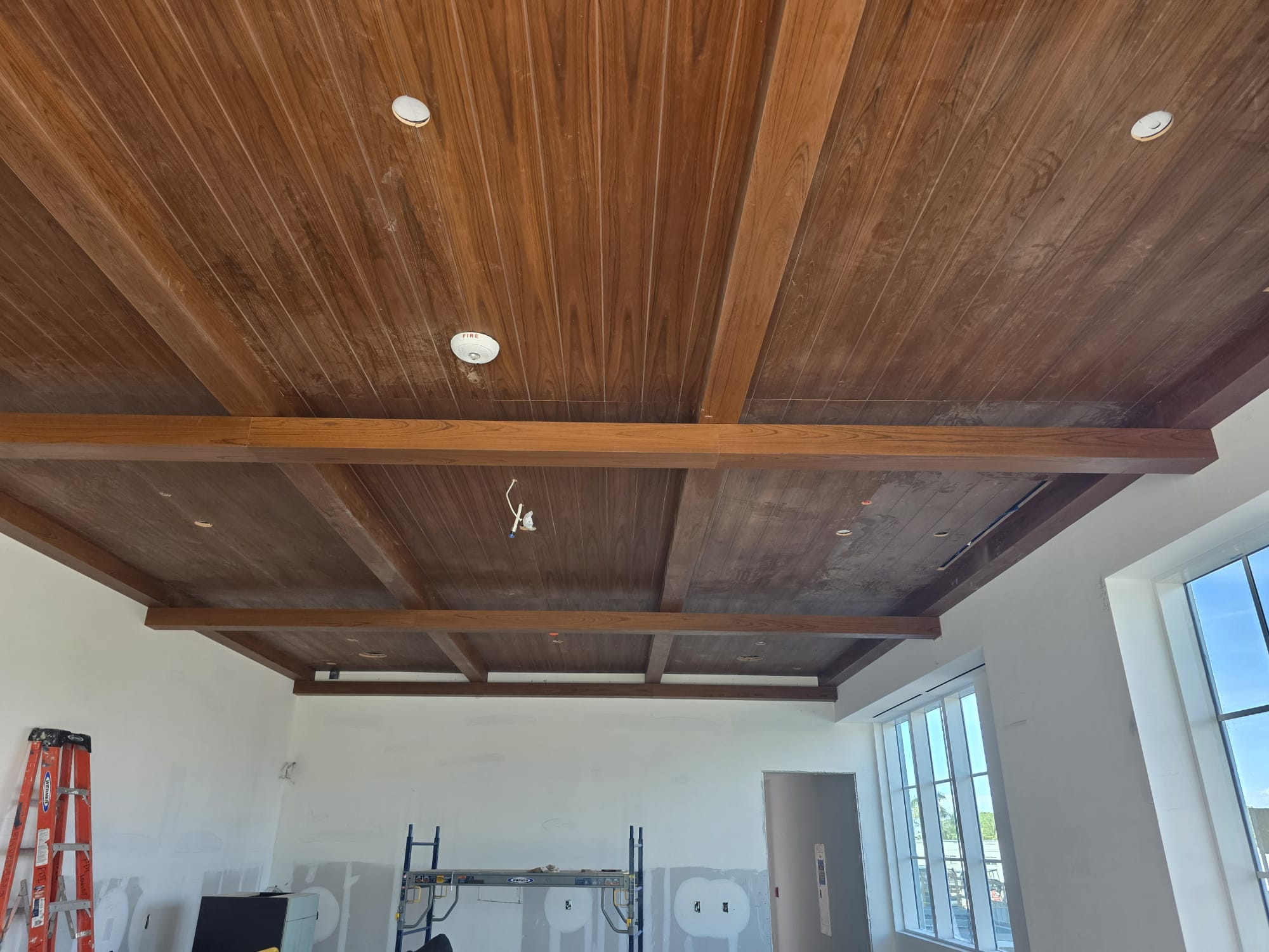 Custom hardwood coffered beam ceiling grid with vertical grain plank inserts in Lewisville NC