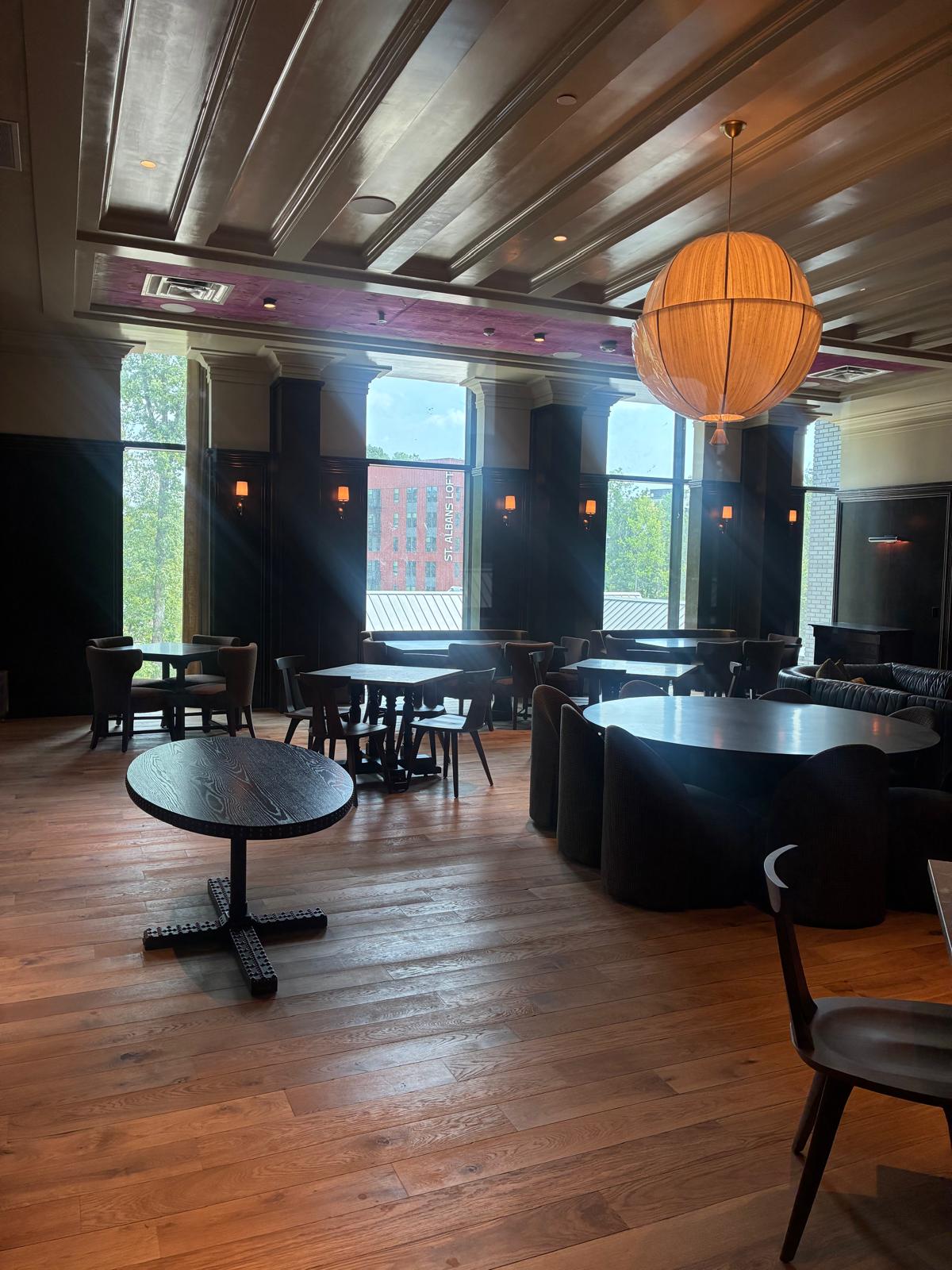 Grand coffered beam ceiling and wide-plank hardwood flooring in luxury Winston-Salem venue