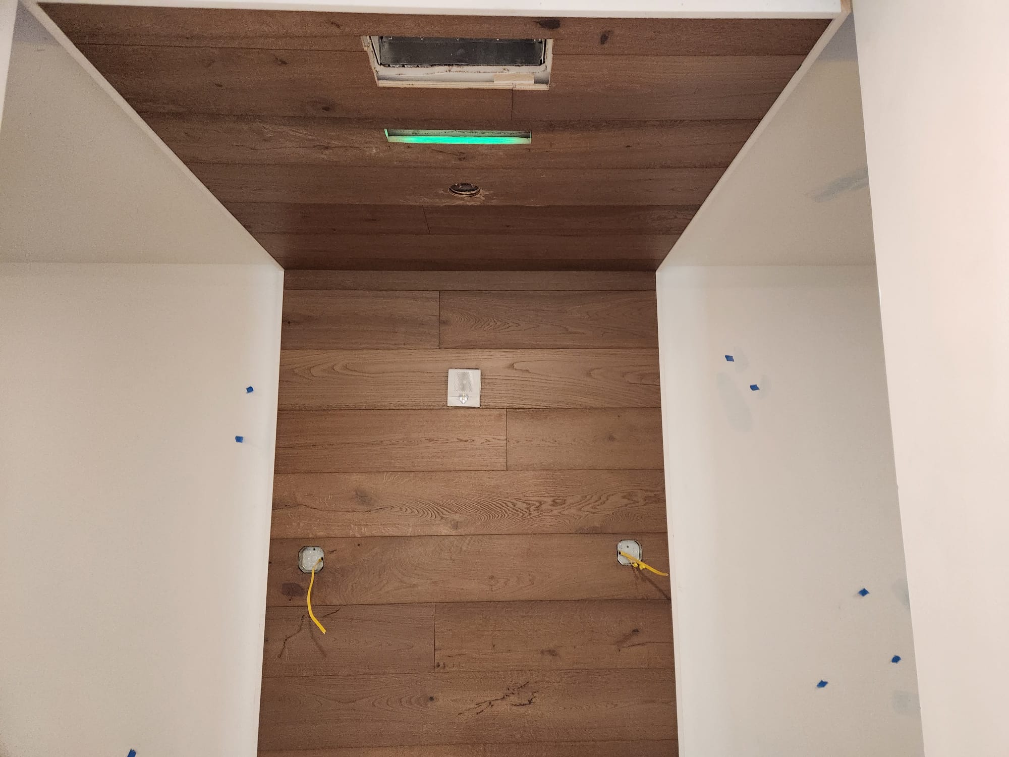 Recessed architectural alcove with horizontal wide plank oak wall cladding and ceiling wrap in Clemmons NC