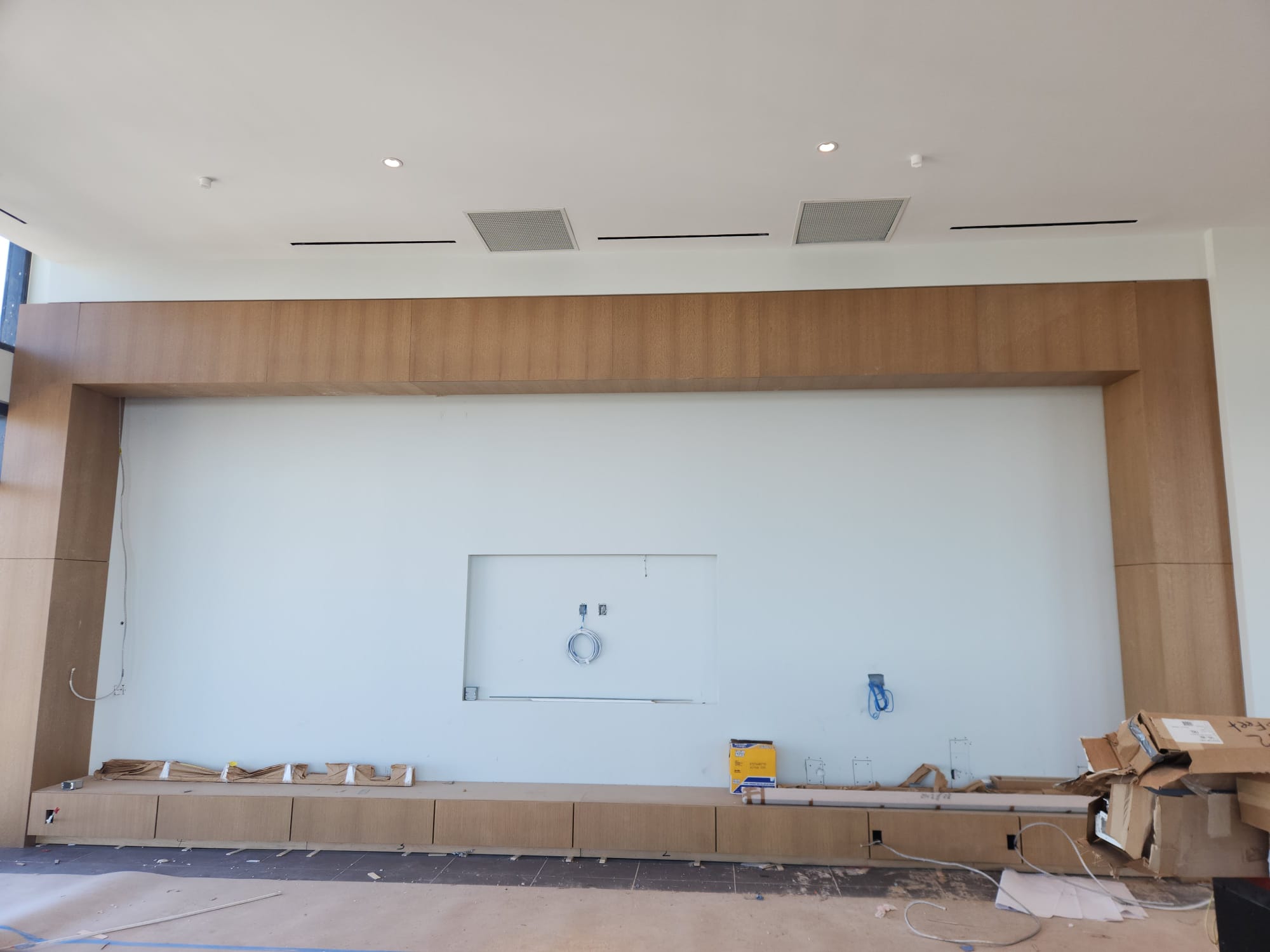 Custom full-span hardwood header portal framing and built-in low base credenza storage in Clemmons NC