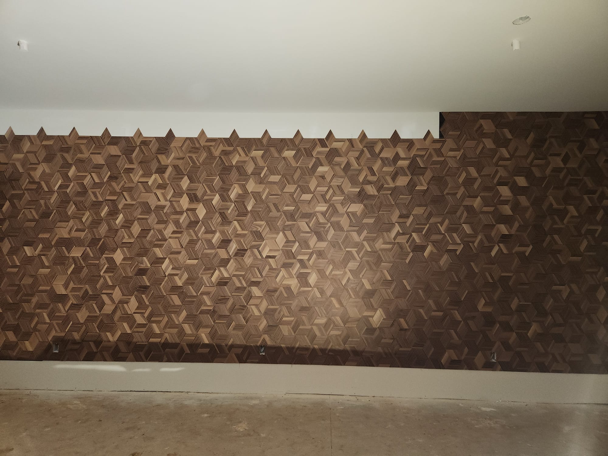 Custom 3D optical cube wooden mosaic feature wall installation in progress in Greensboro NC