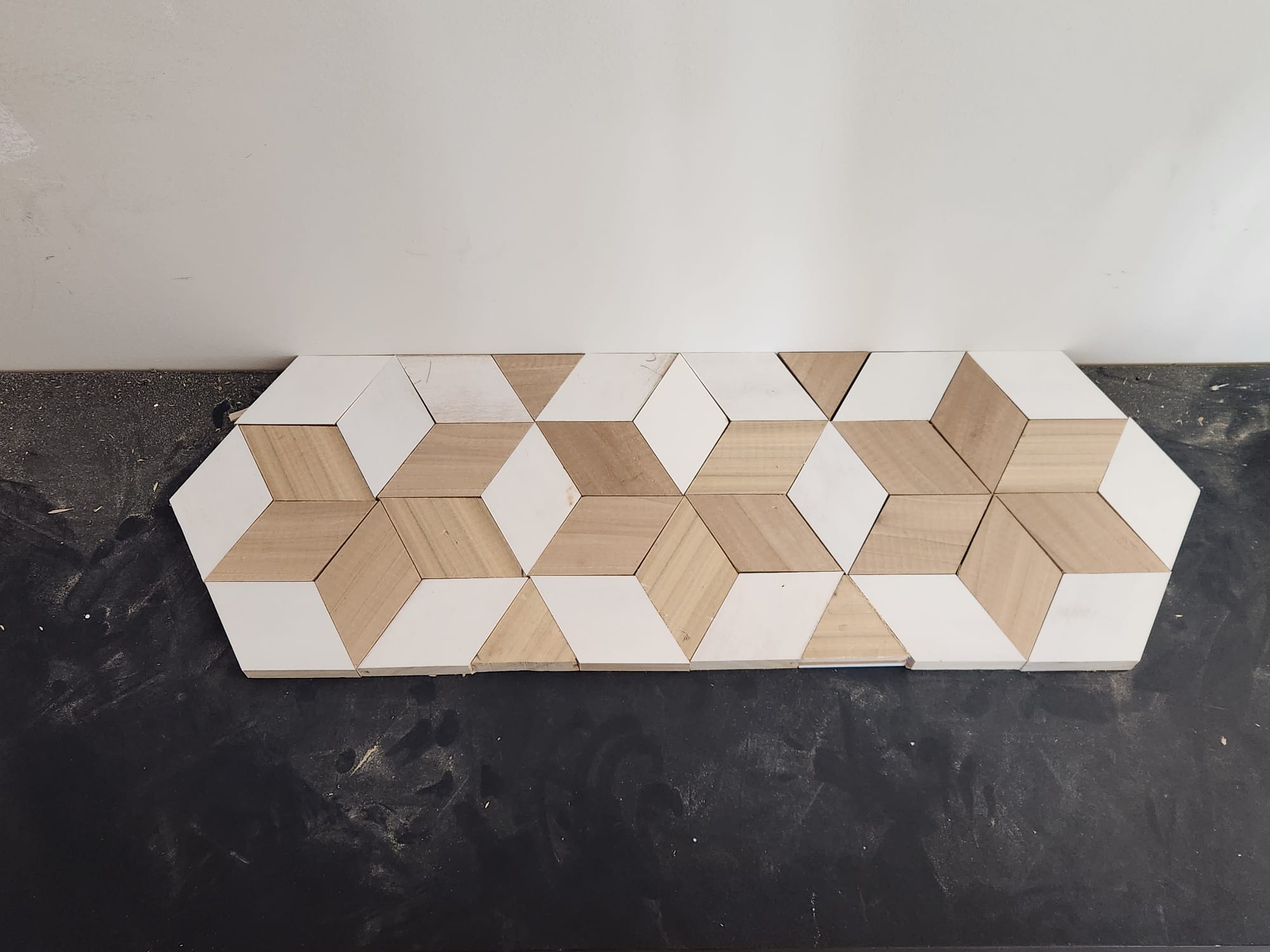 Handcrafted geometric diamond wood mosaic and optical cube pattern mockup by Crafted Wood & Trim in Winston-Salem NC