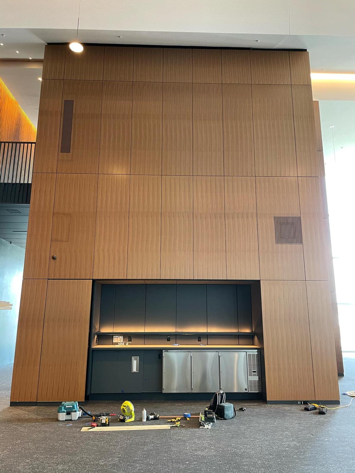 Full height architectural wood panel wall with built in wet bar niche in Winston-Salem NC