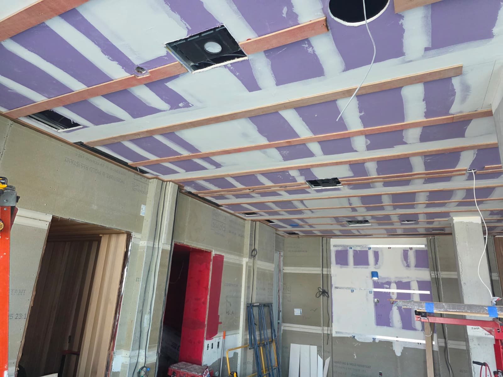 Ceiling wood furring strip framing and junction cutouts installed by Crafted Wood & Trim in Lewisville NC