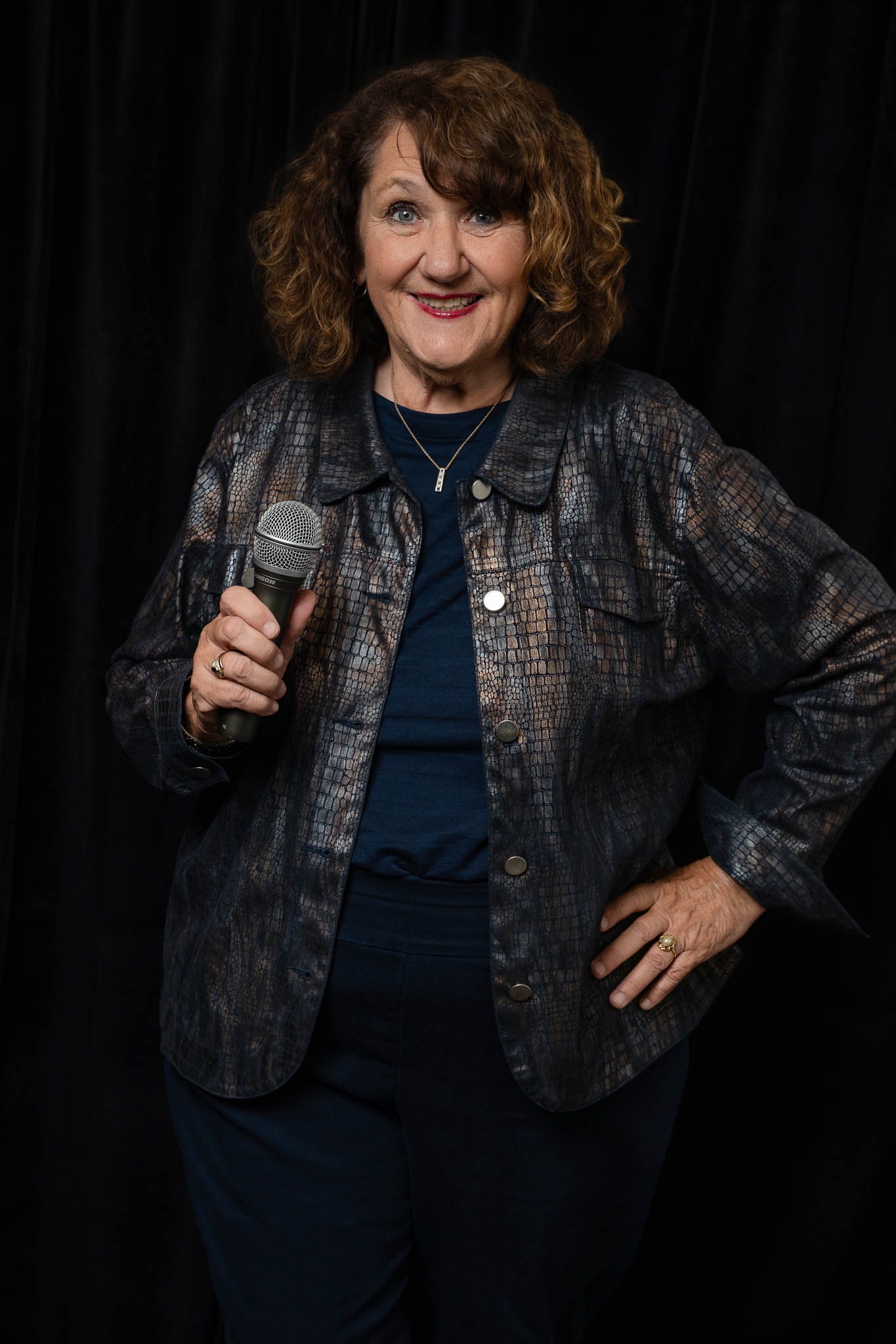 Nancy C Jones speaking with microphone