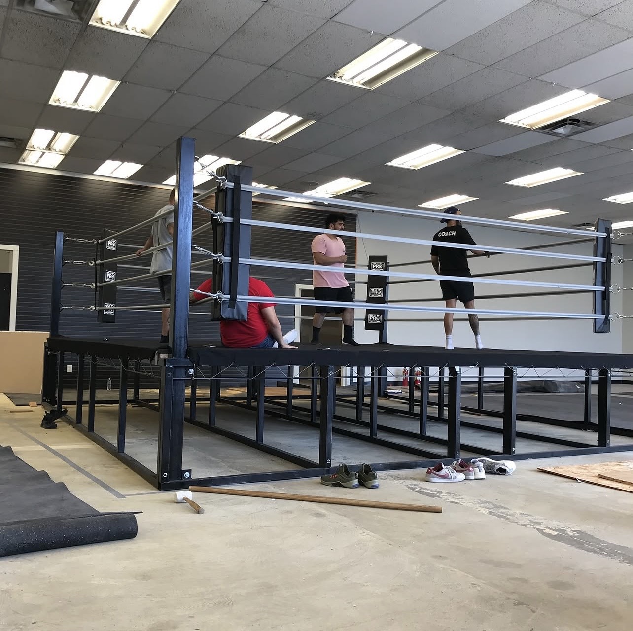 Building the Pro Last boxing ring from scratch — Chris, Erickson, and team assembling the ring platform