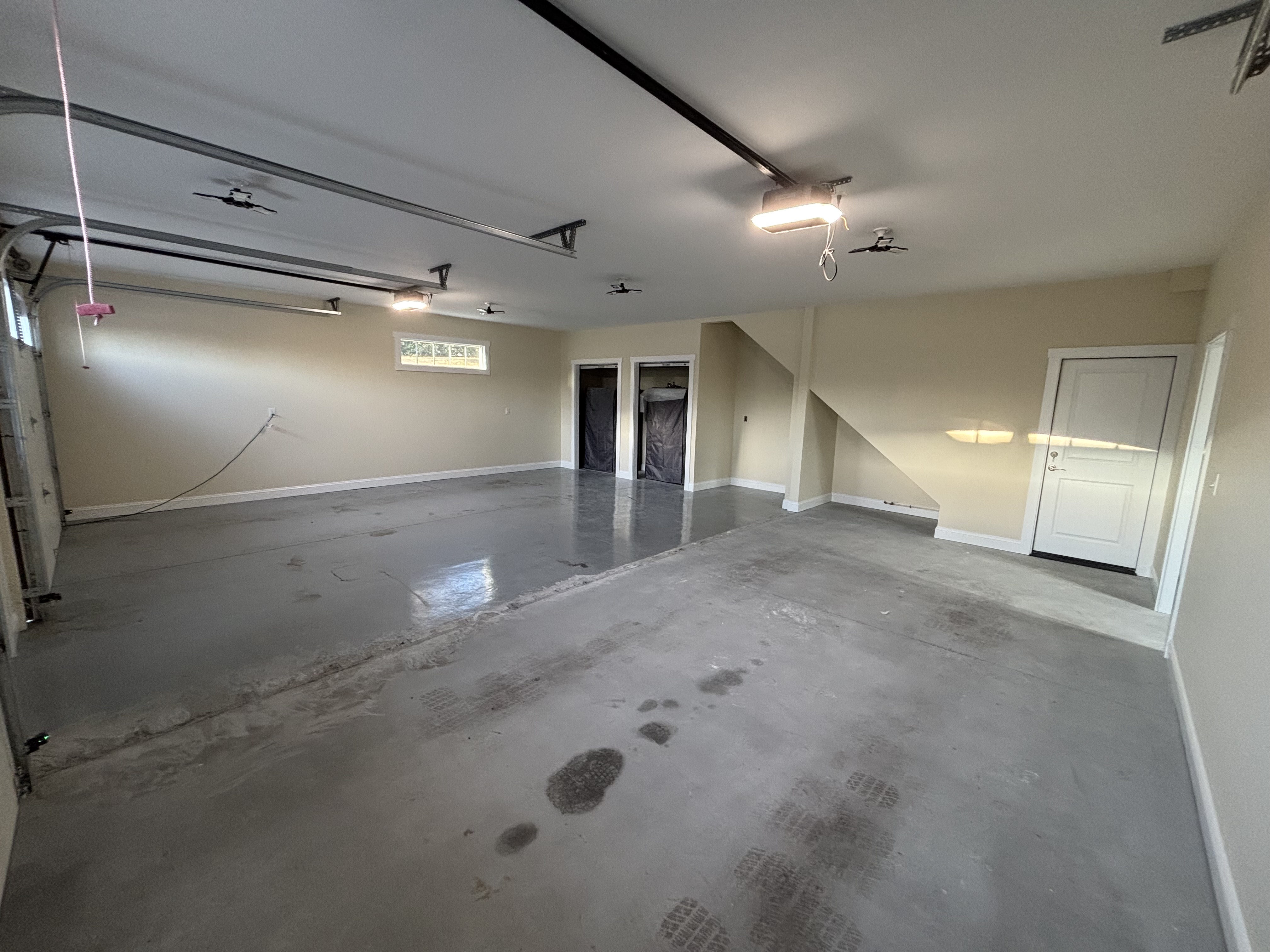 Before: Unfinished stained concrete garage floor