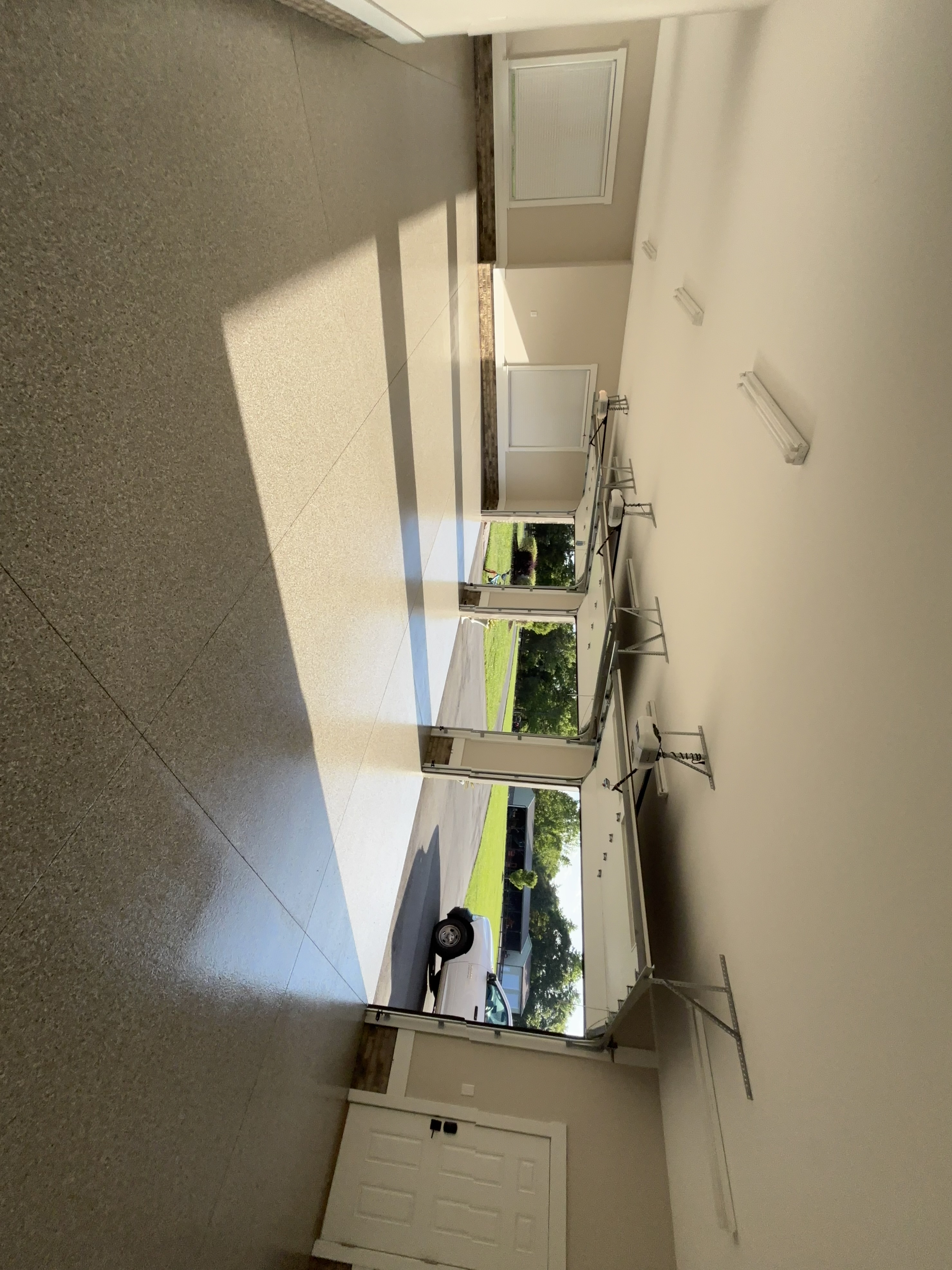 Multi-bay garage floor transformation with clean flake finish