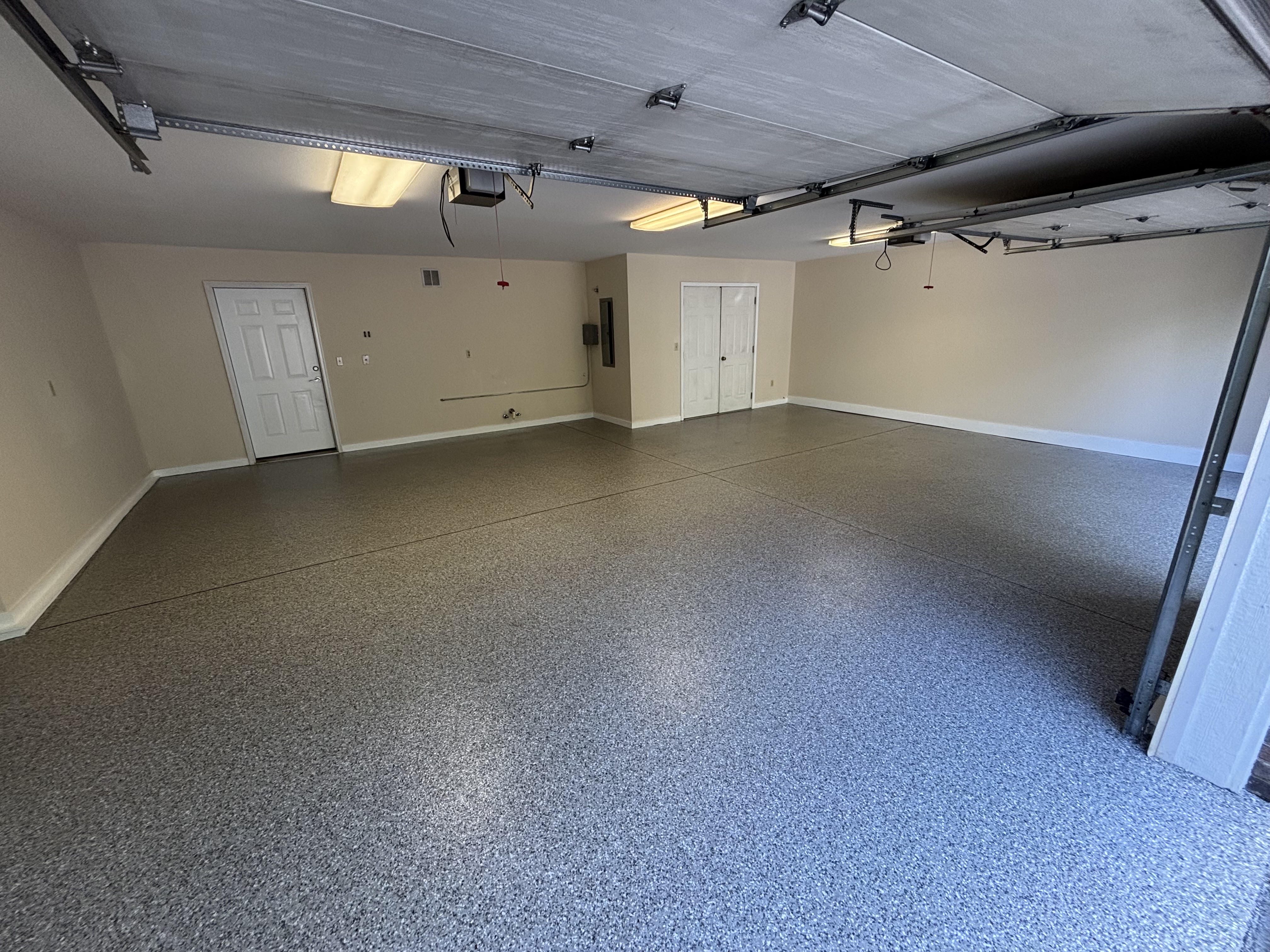 Spacious completed multi-car garage with seamless flake floor