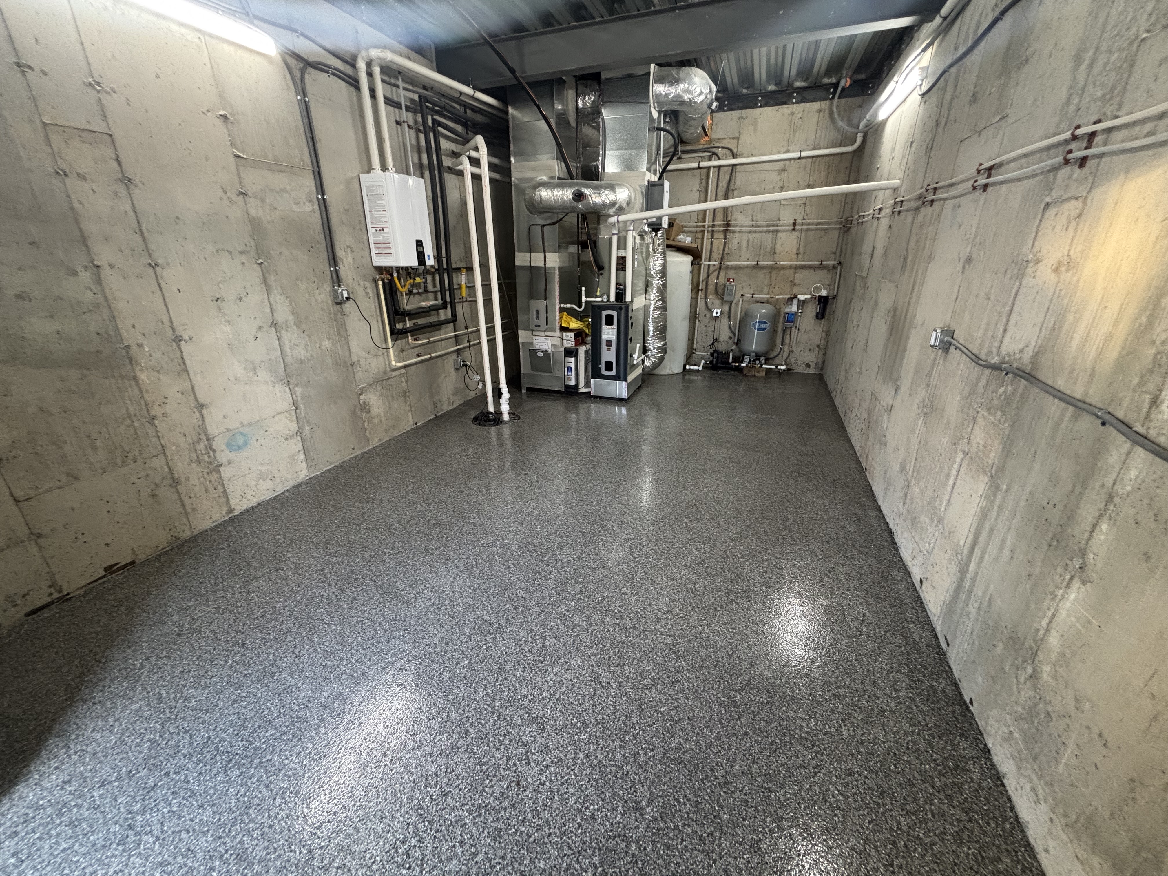 Finished industrial utility room with durable flake flooring