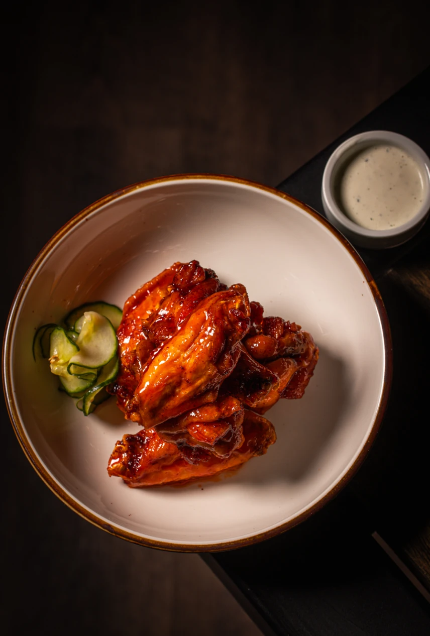 Crispy glazed buffalo wings with ranch dipping sauce