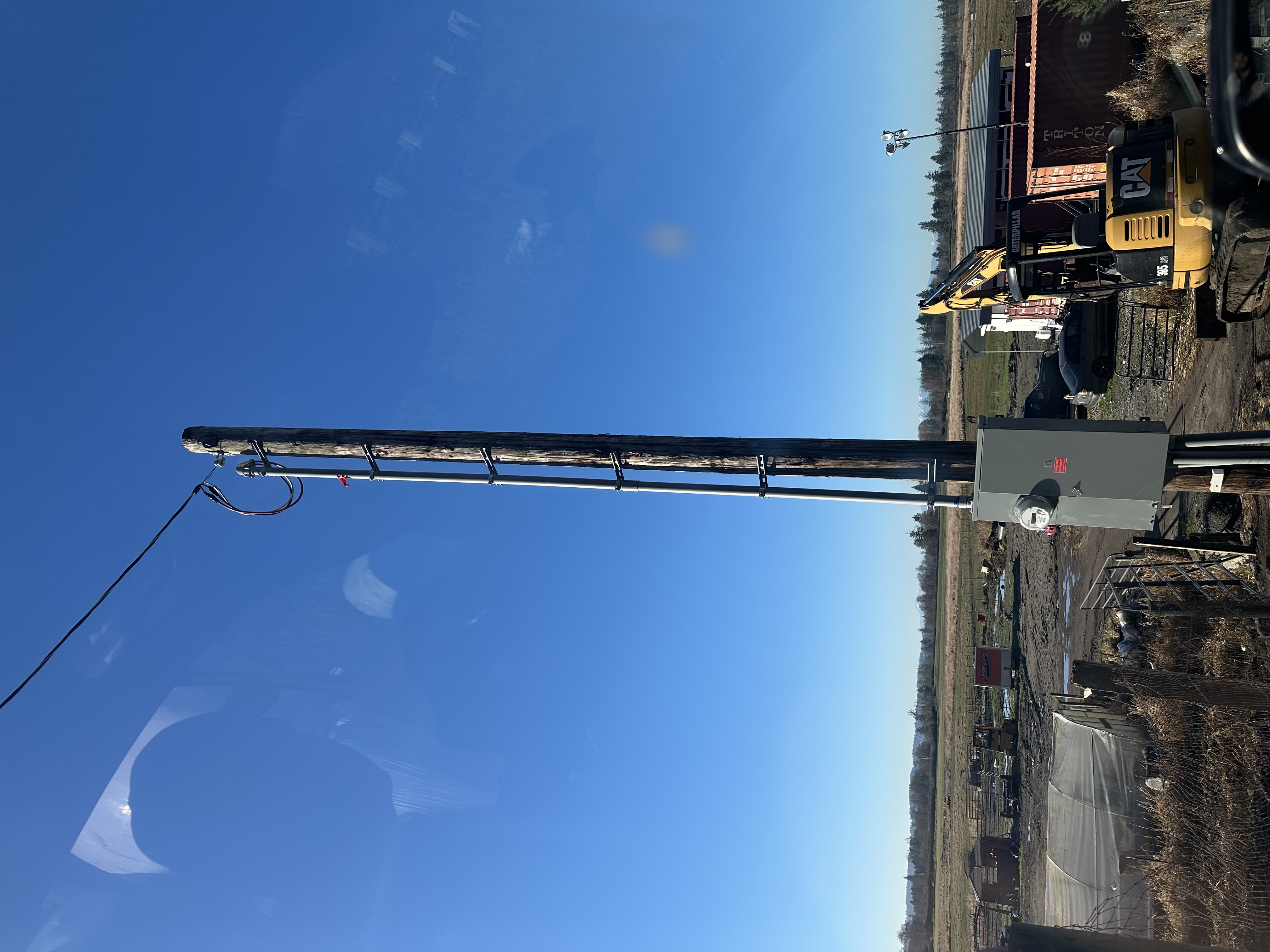 Utility service mast and overhead drop installation