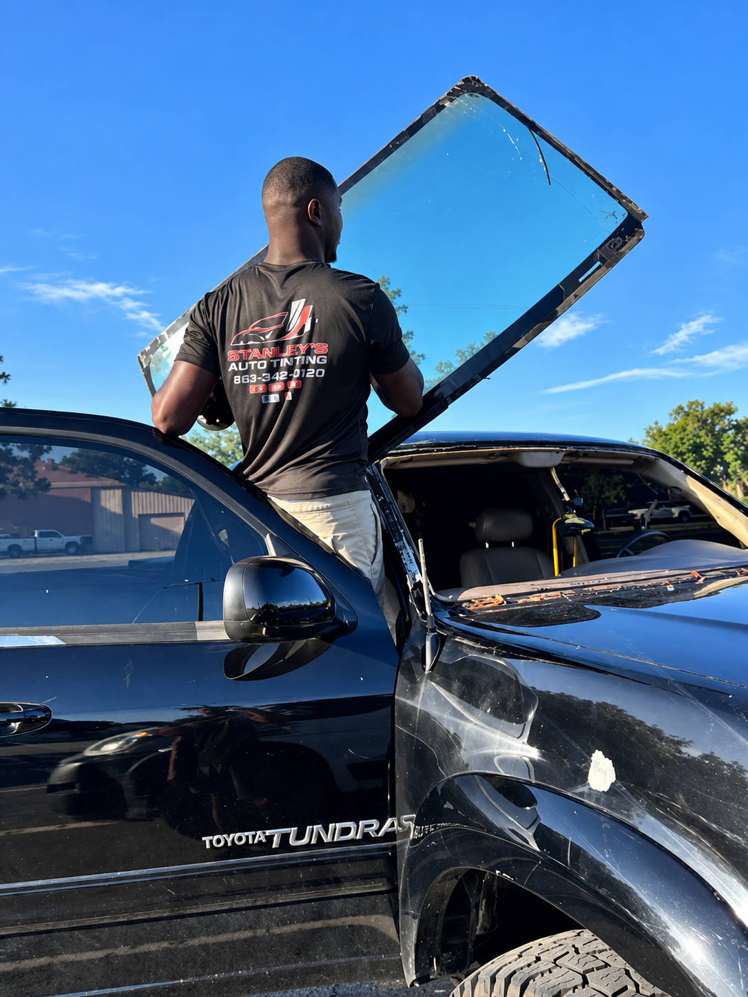 Stanley replacing damaged windshield on vehicle in Lakeland, FL