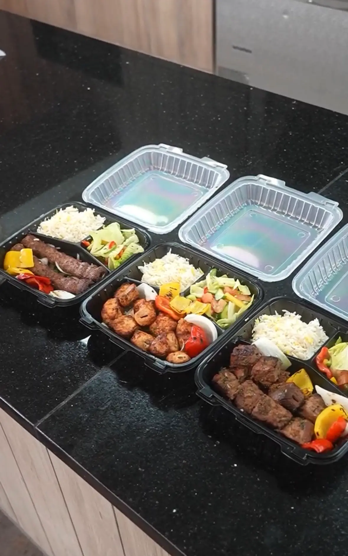 Hala Market catering trays with grilled meats and rice bowls