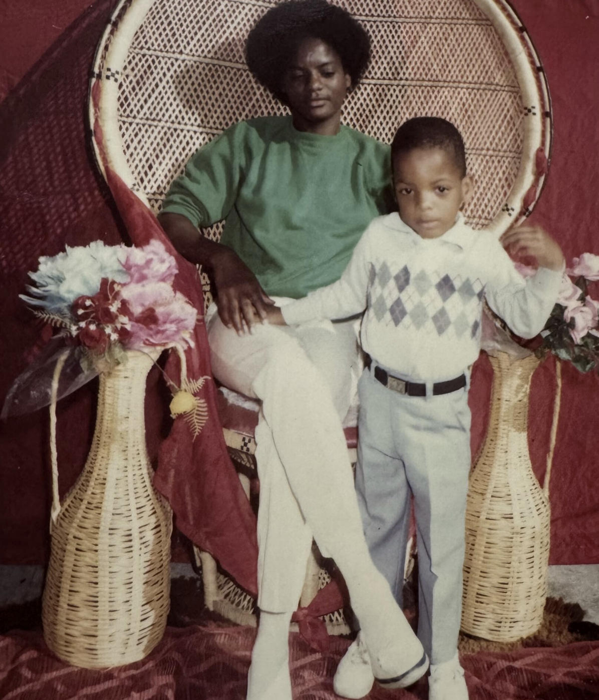 Color portrait of woman in green sweater with young boy in argyle sweater vest