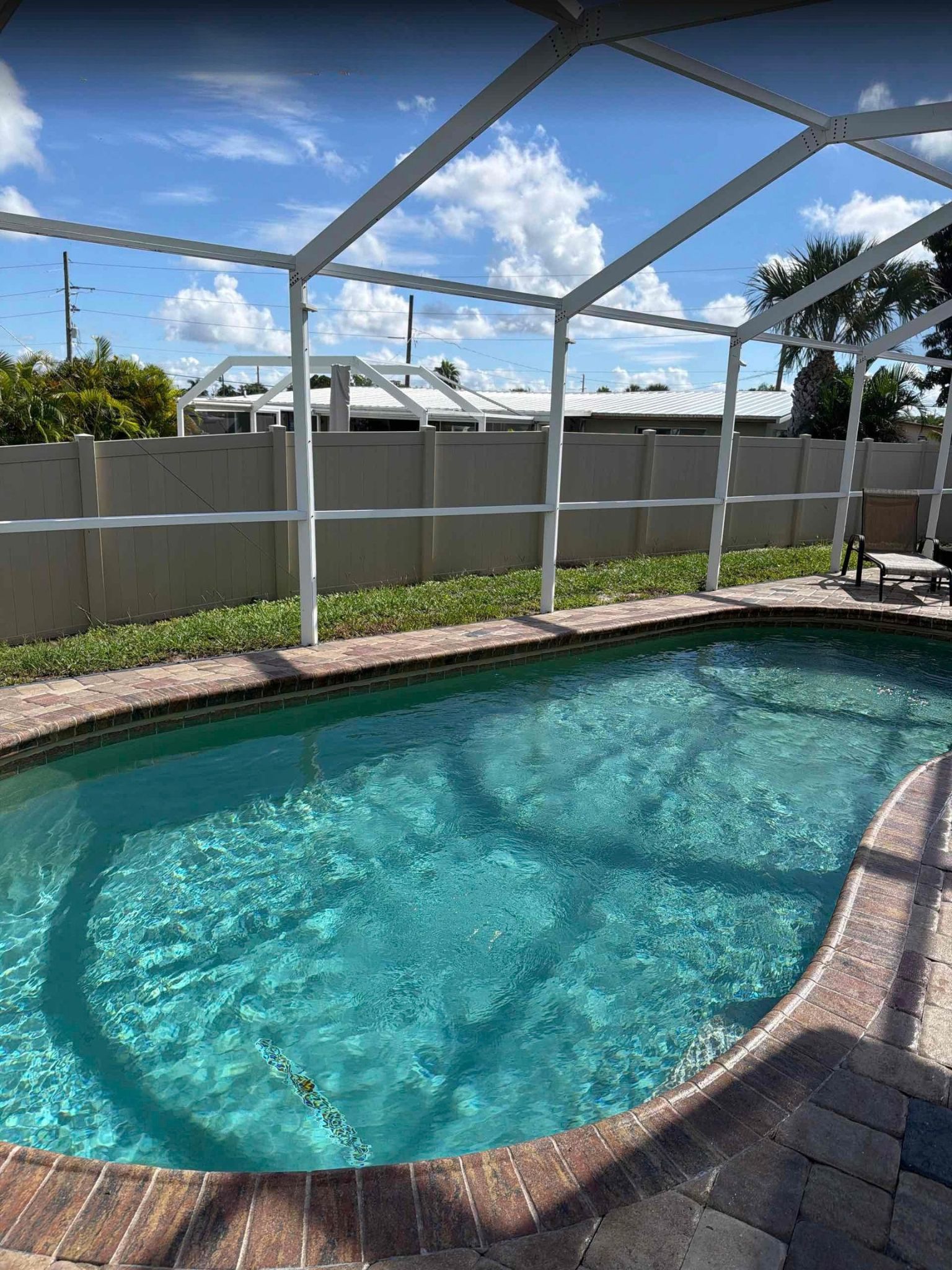 Pool cleaning service in Laurel backyard pool