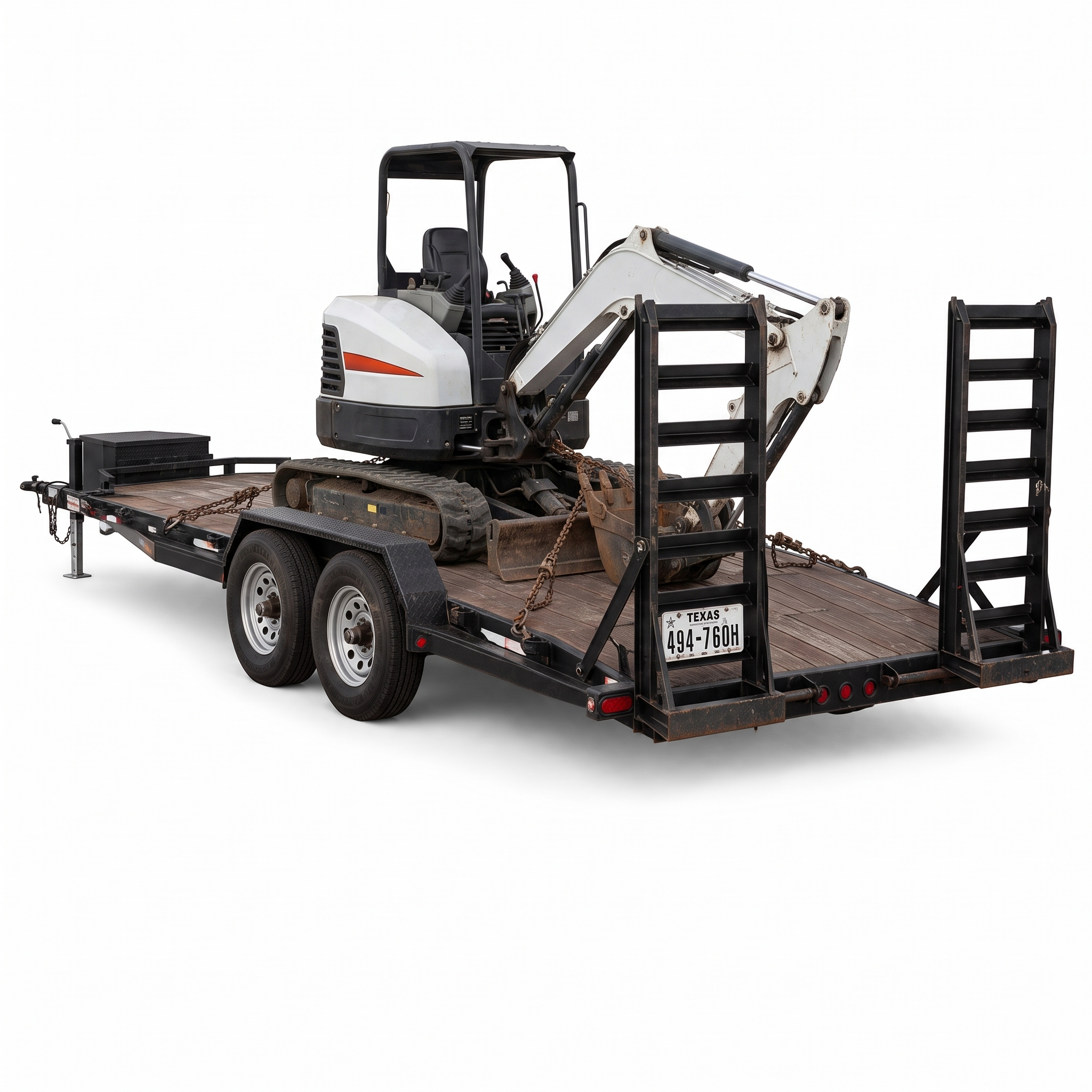 7 by 20 foot car hauler loaded with a compact excavator chained down to the deck